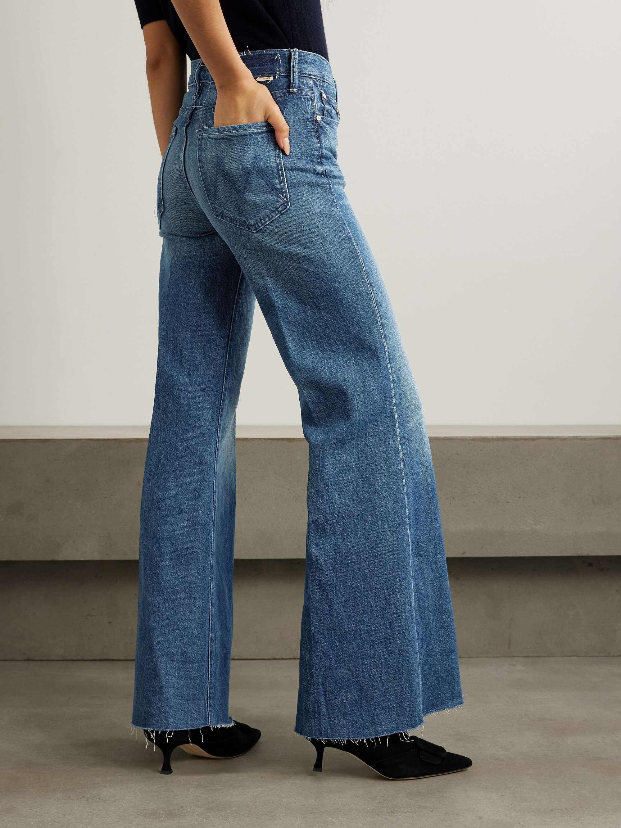 The Twister Sneak distressed high-rise wide-leg jeans view