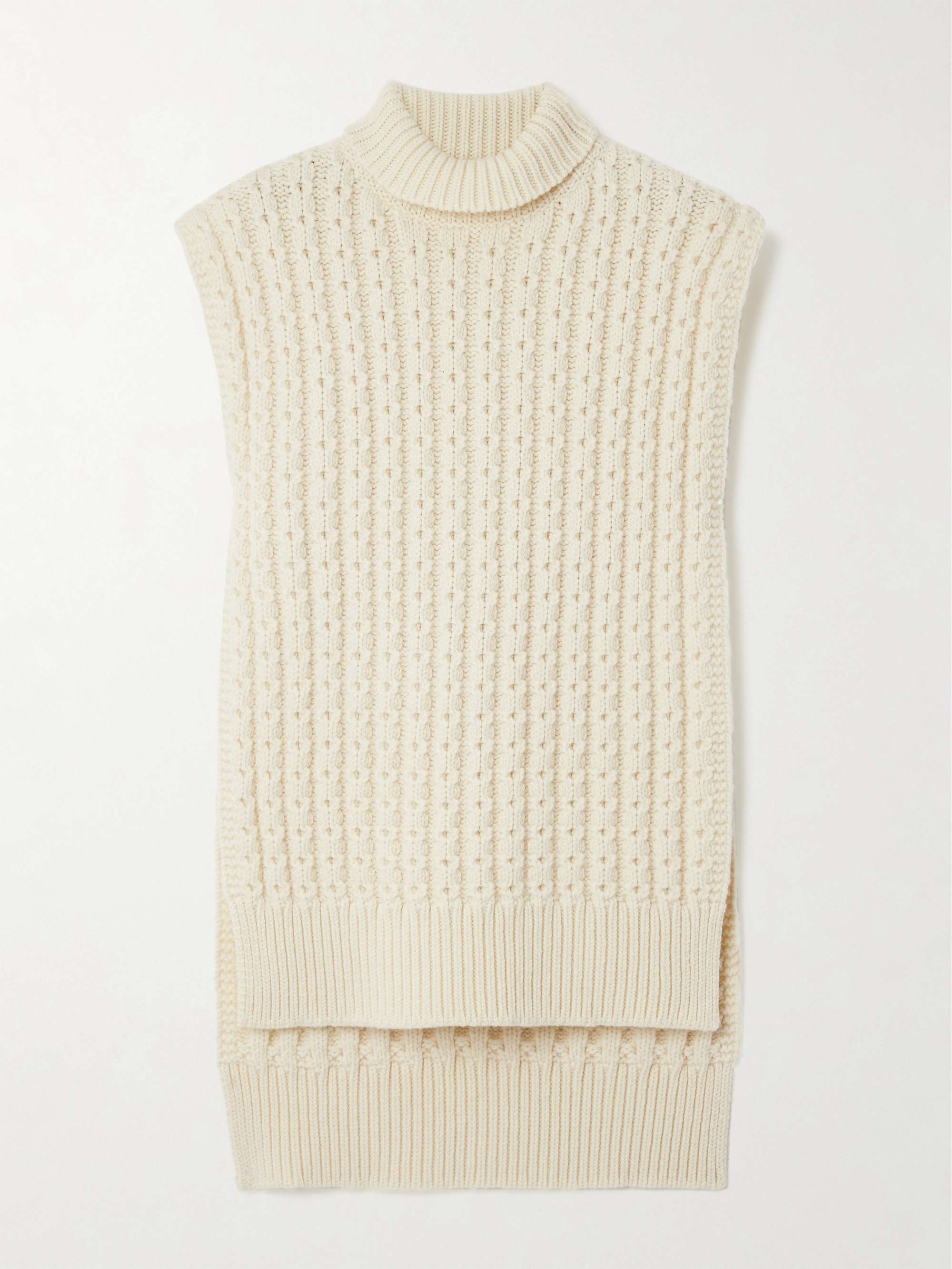 Oversized belted ribbed wool turtleneck sweater vest hero visual