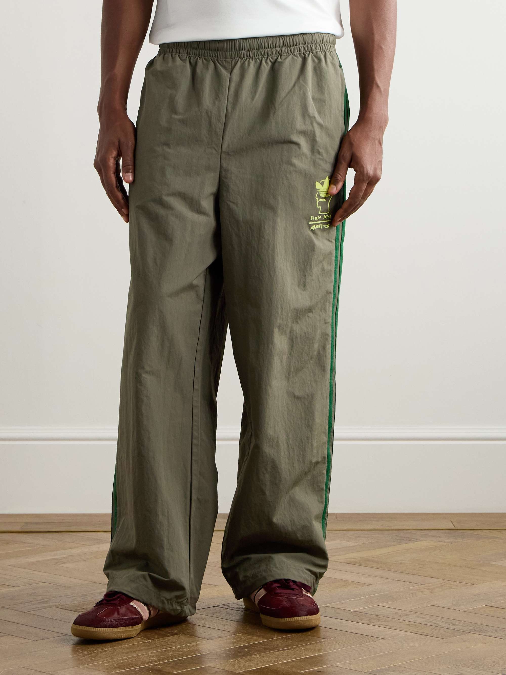 + Brain Dead Wide-Leg Logo-Flocked Striped Shell Track Pants view