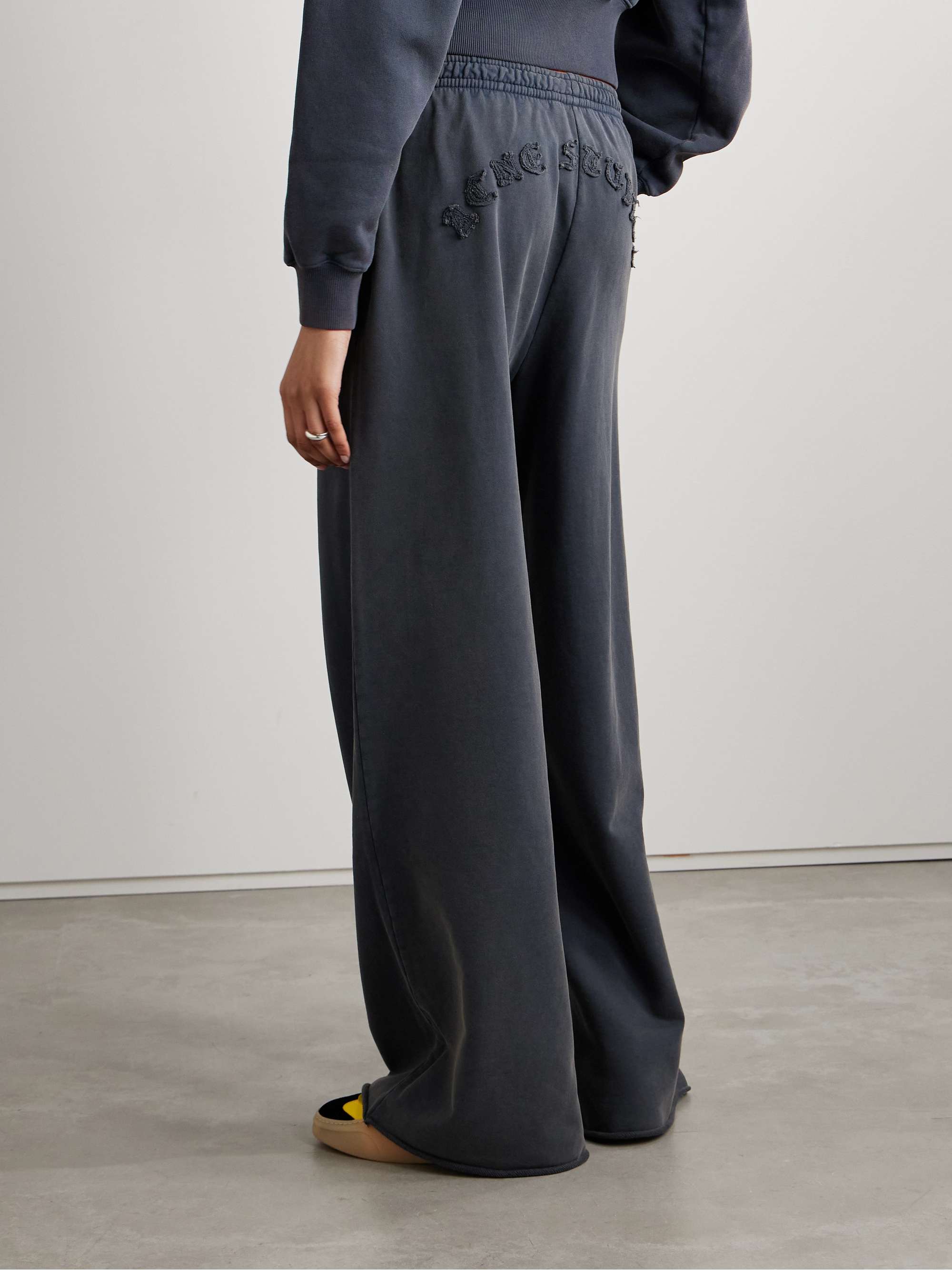 Appliquéd cotton-jersey wide-leg track pants view