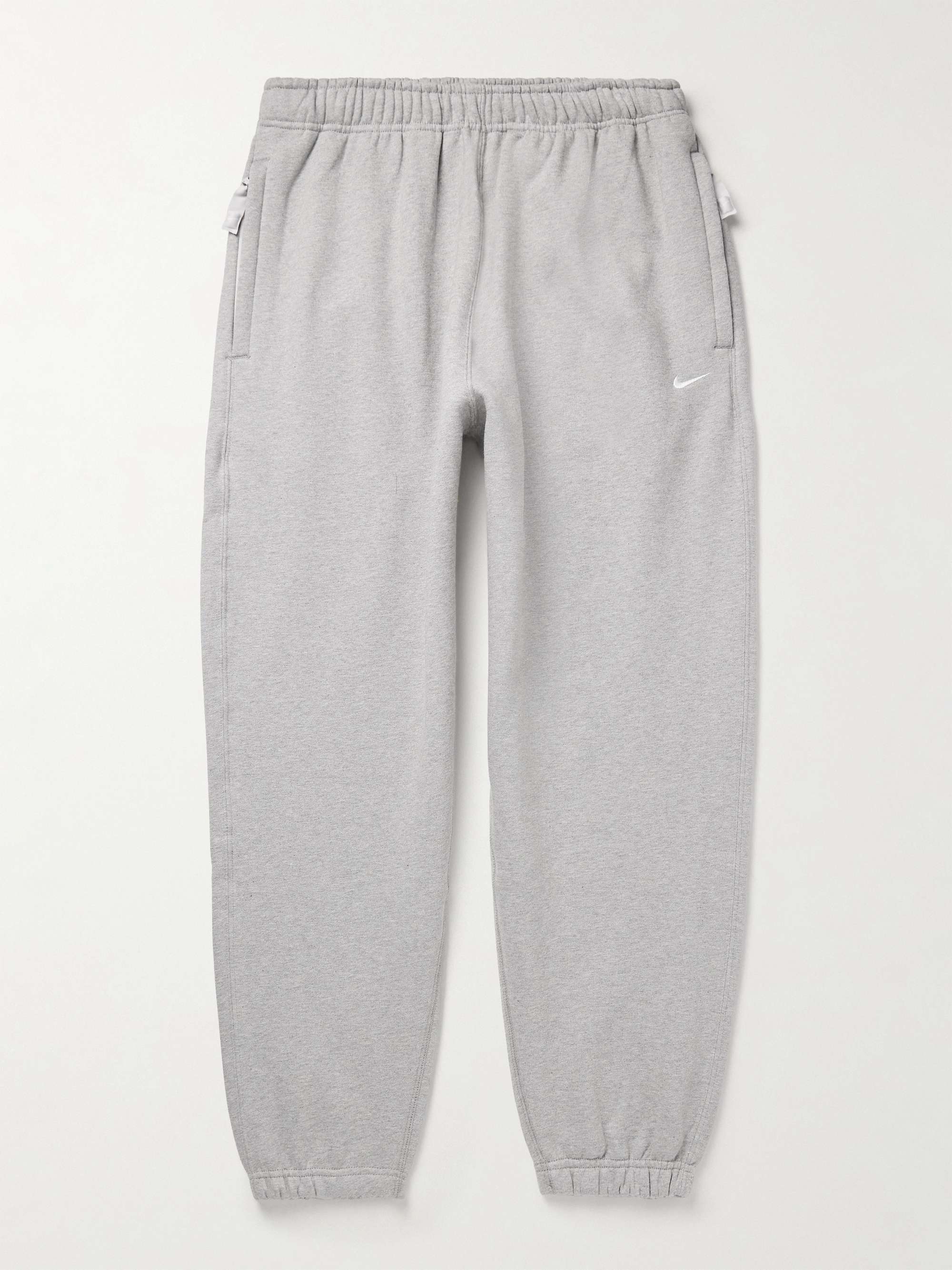 Solo Swoosh Tapered Logo-Embroidered Cotton-Blend Jersey Sweatpants hero visual