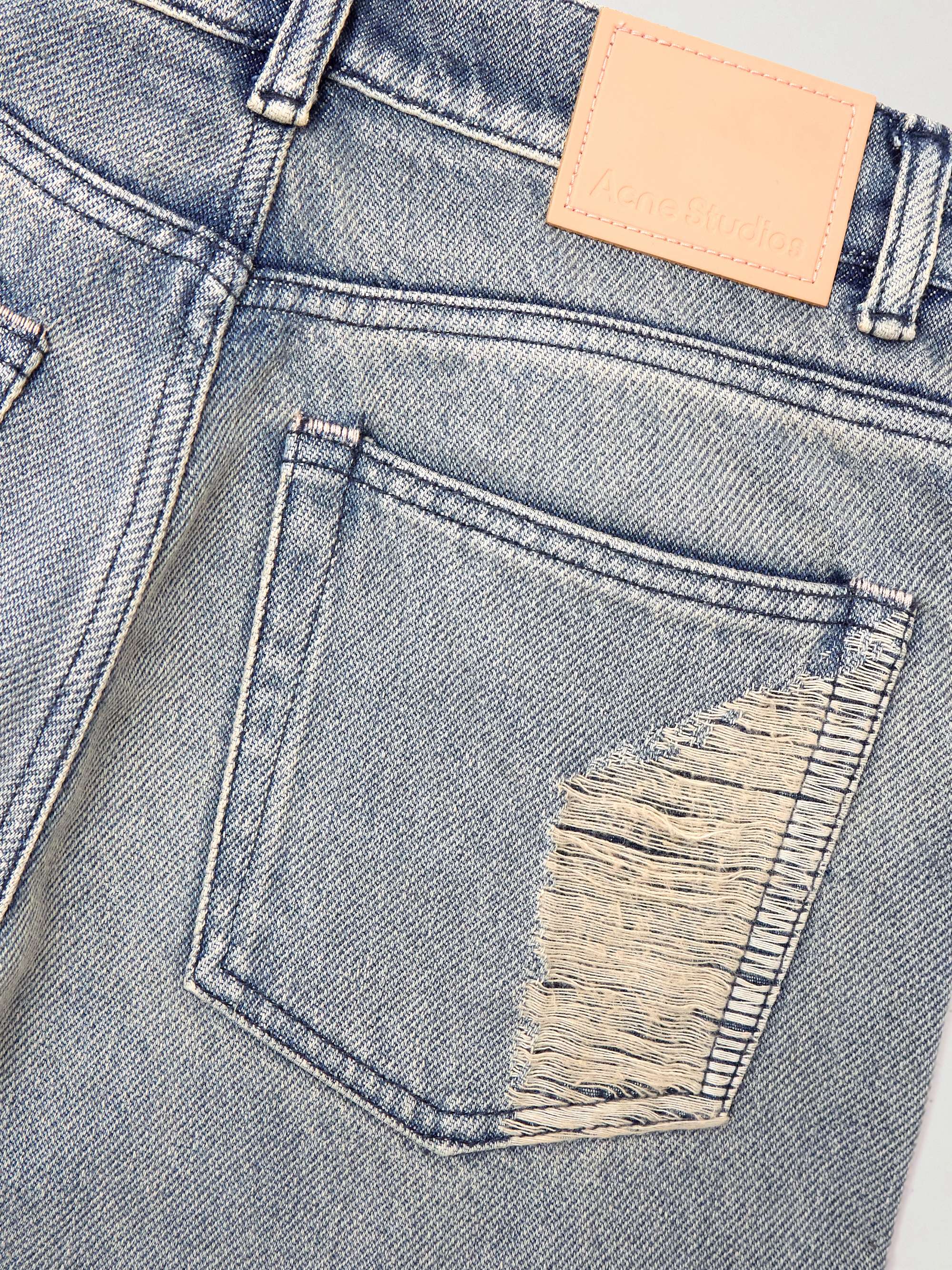 Distressed mid-rise flared jeans view