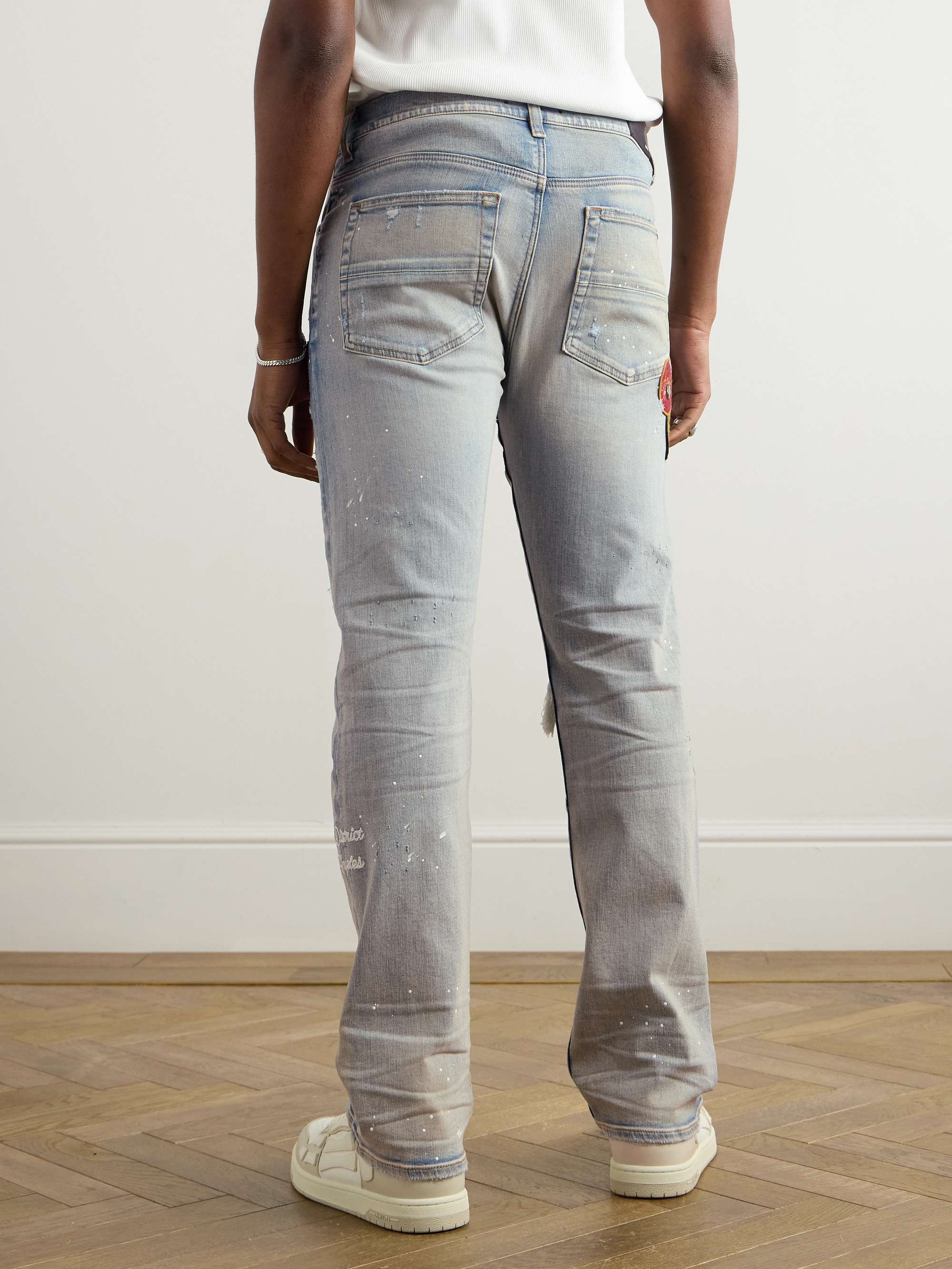 Skinny-Fit Appliquéd Distressed Paint-Splattered Jeans view