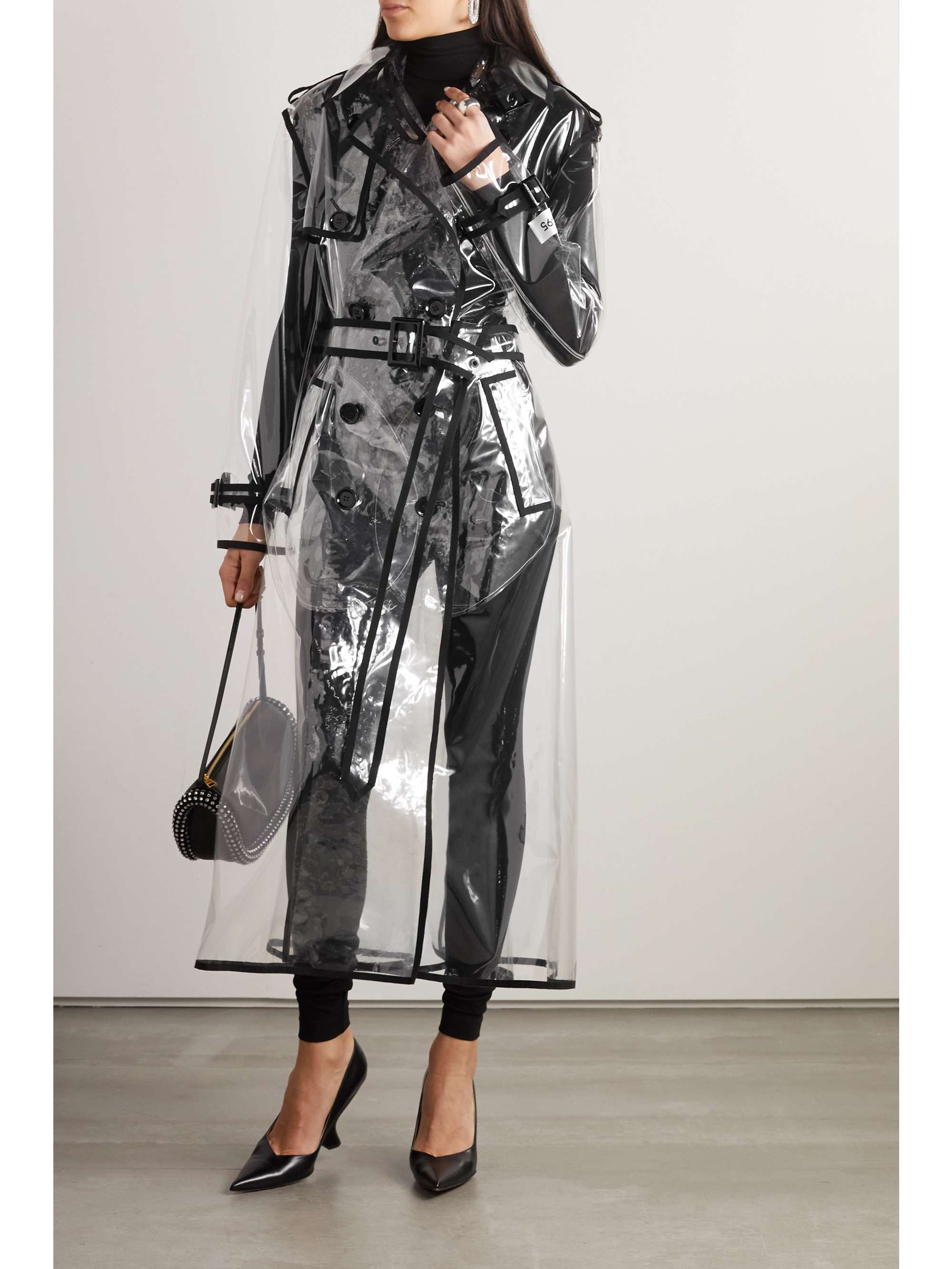 Piped cotton-trimmed PVC trench coat view