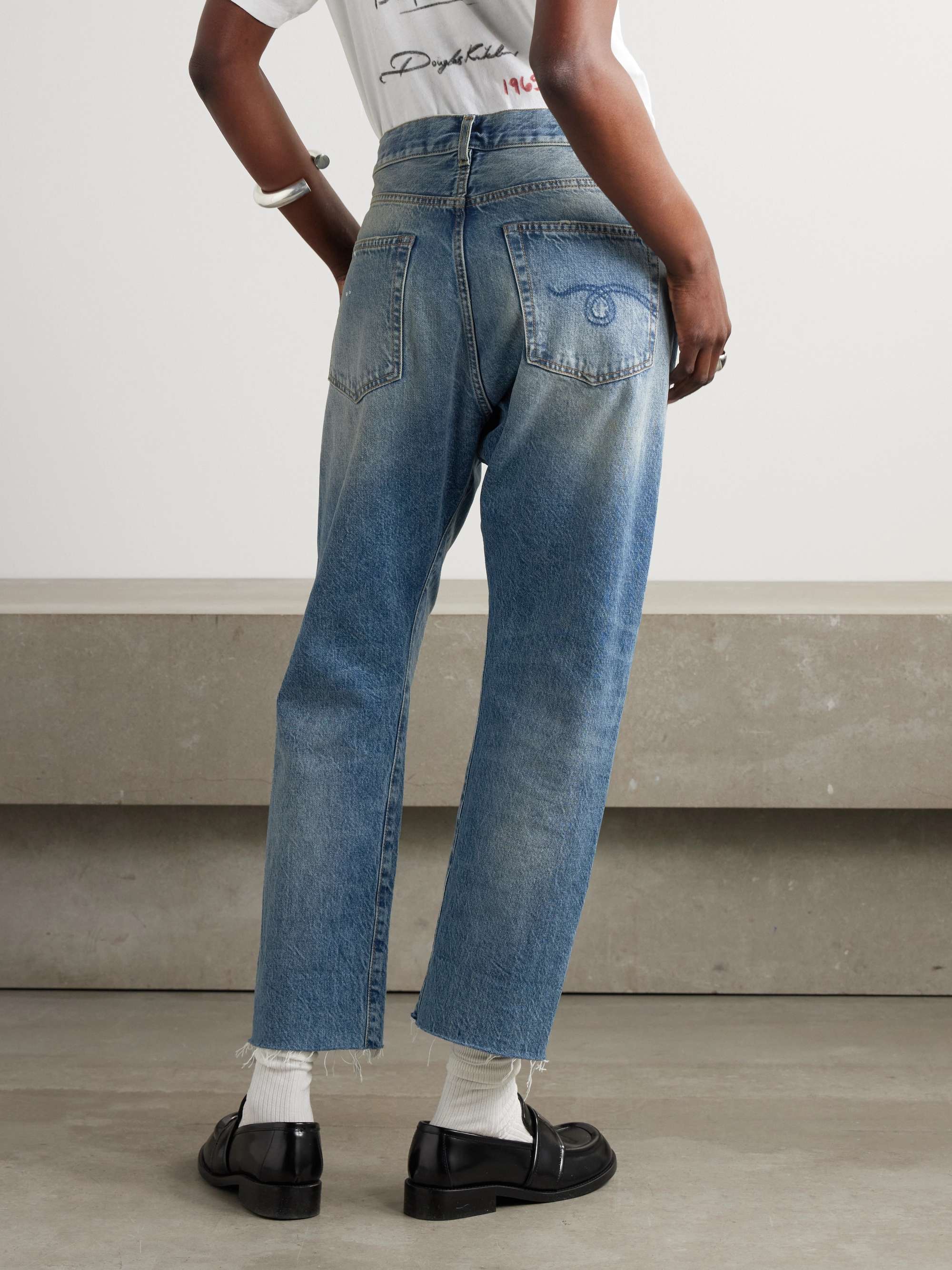Crossover asymmetric distressed high-rise wide-leg jeans view