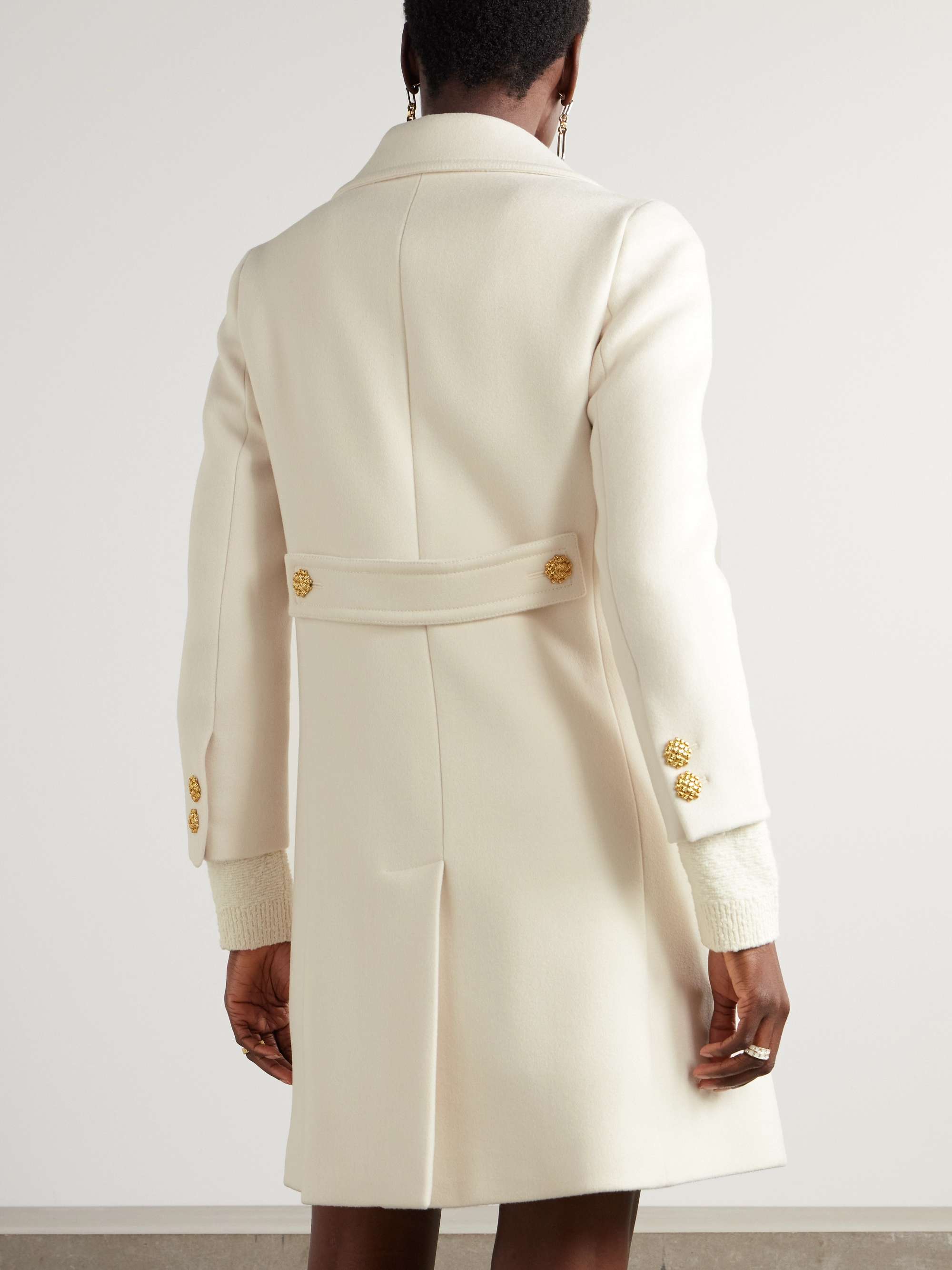 Button-embellished wool coat view