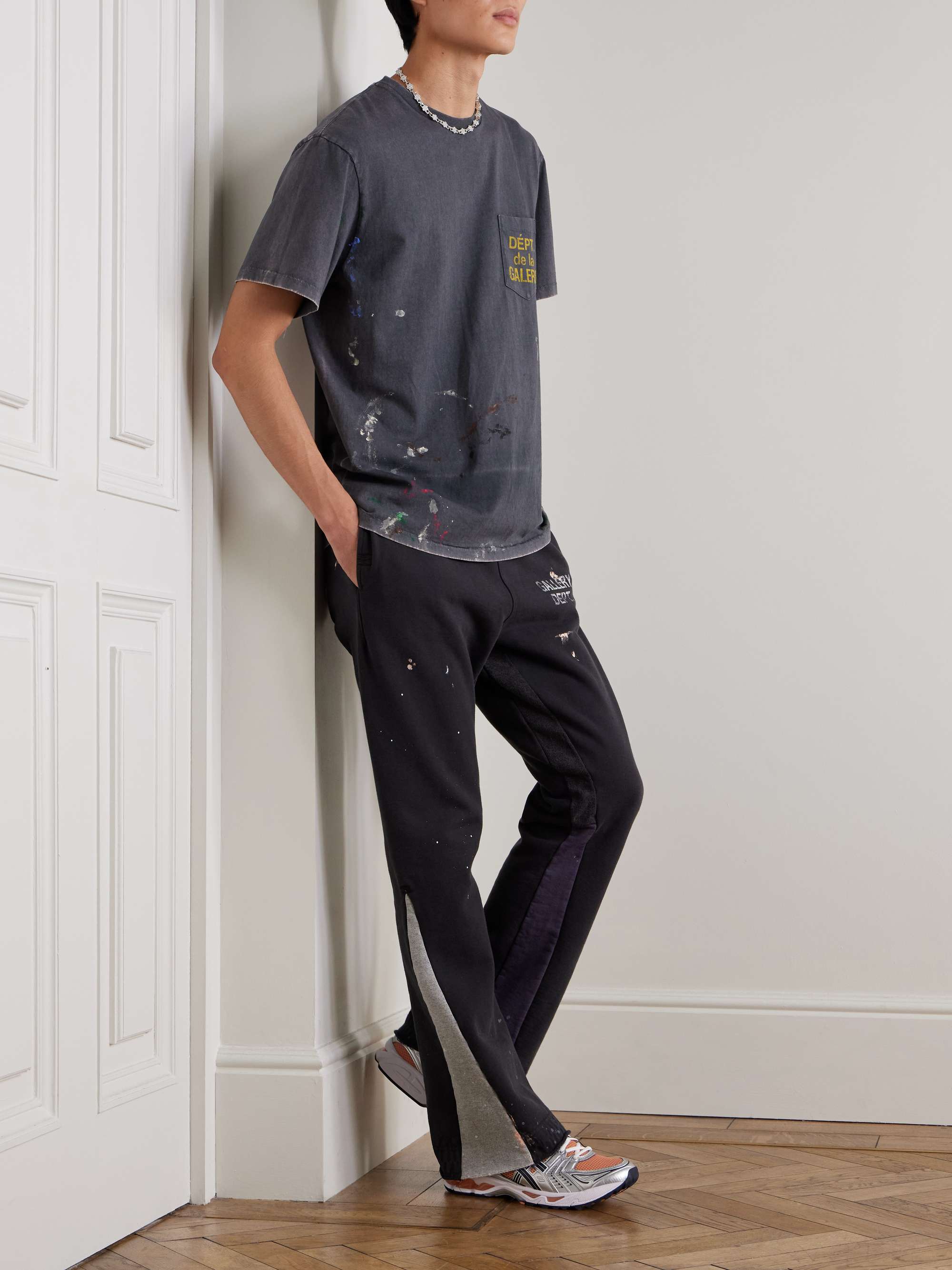 Flared Paint-Splattered Panelled Logo-Print Cotton-Jersey Sweatpants view