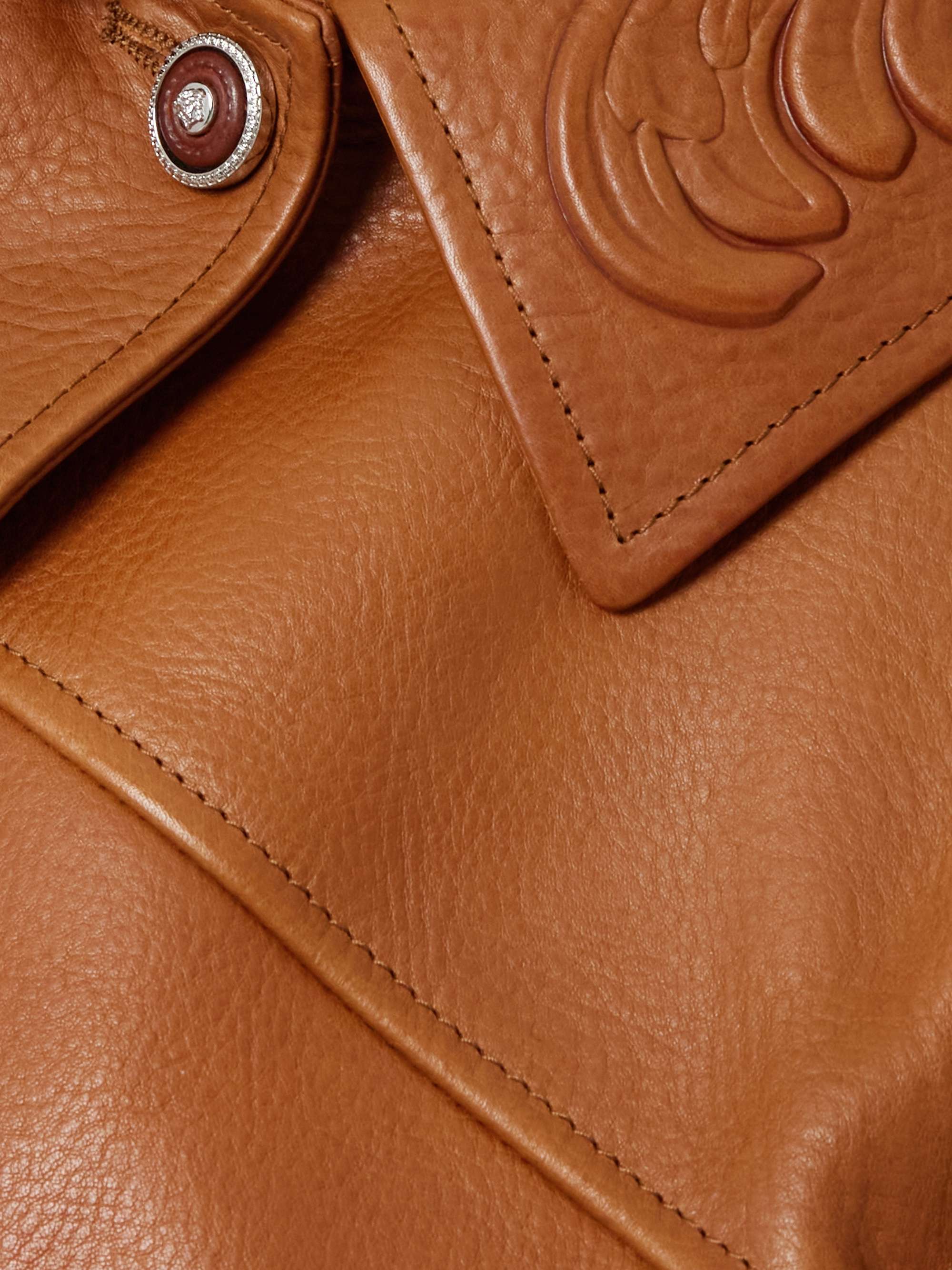 Debossed paneled textured-leather jacket view