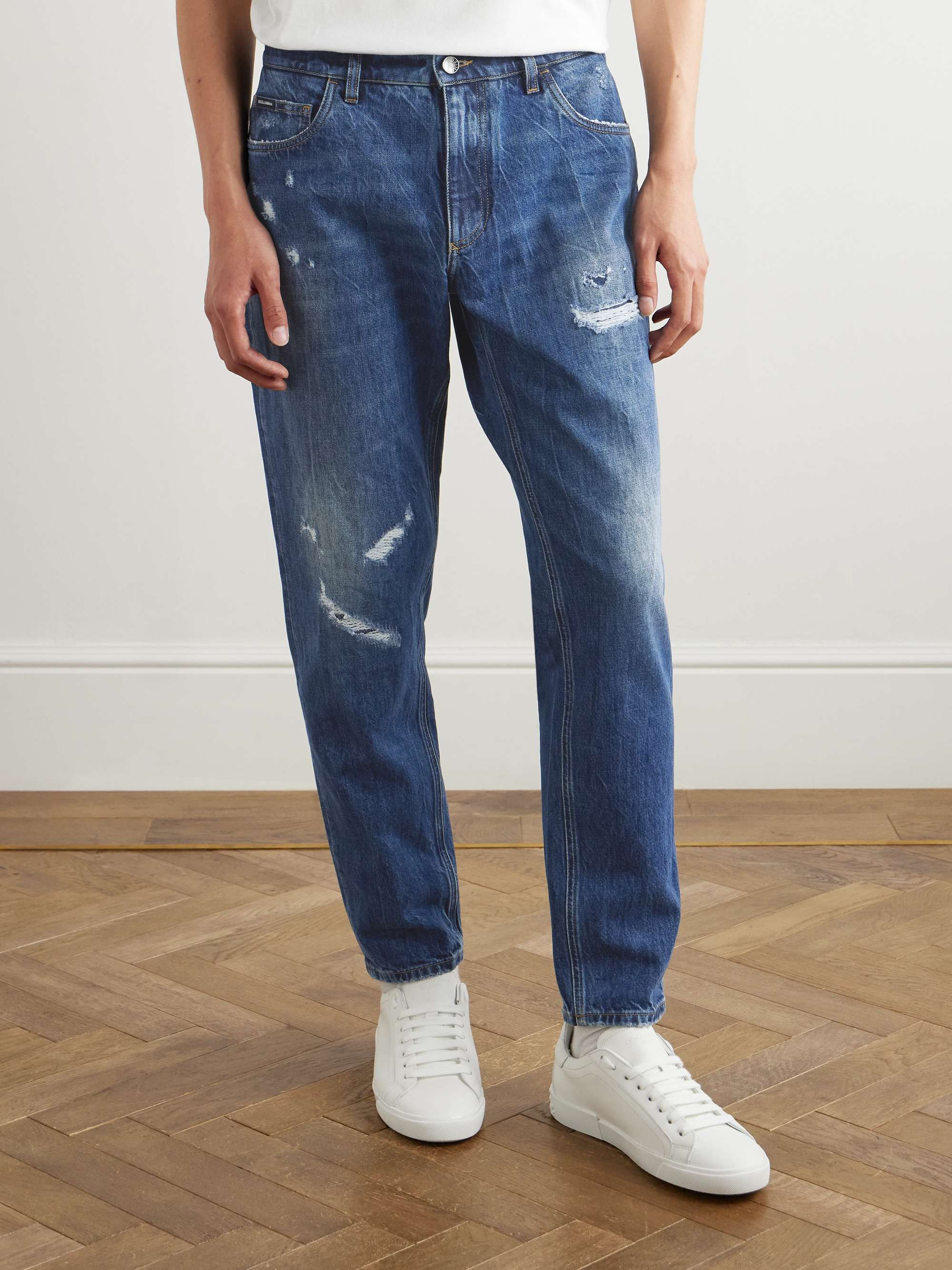 Slim-Fit Tapered Logo-Embroidered Distressed Jeans view