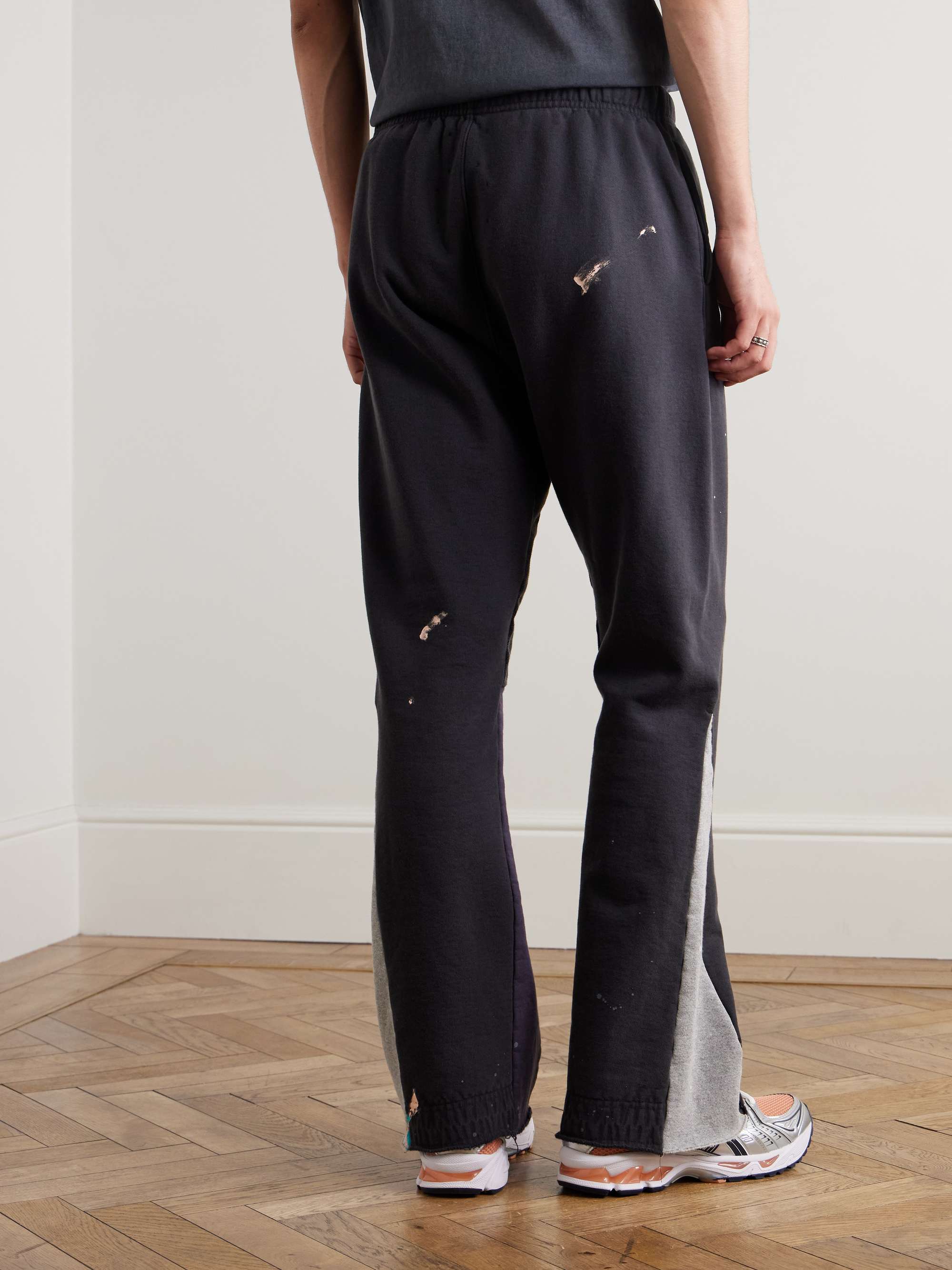 Flared Paint-Splattered Panelled Logo-Print Cotton-Jersey Sweatpants view