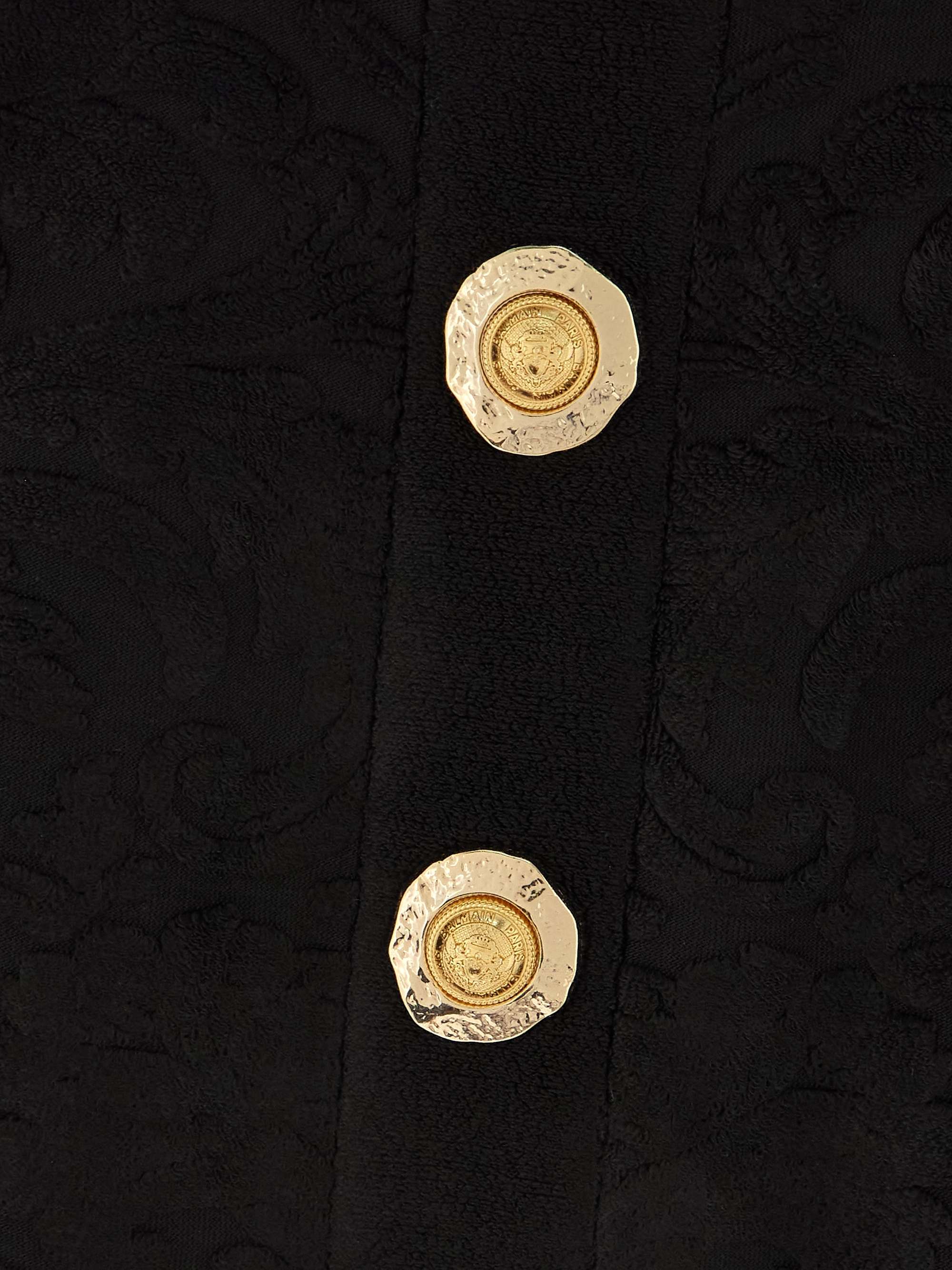 Cropped button-embellished jacquard top view