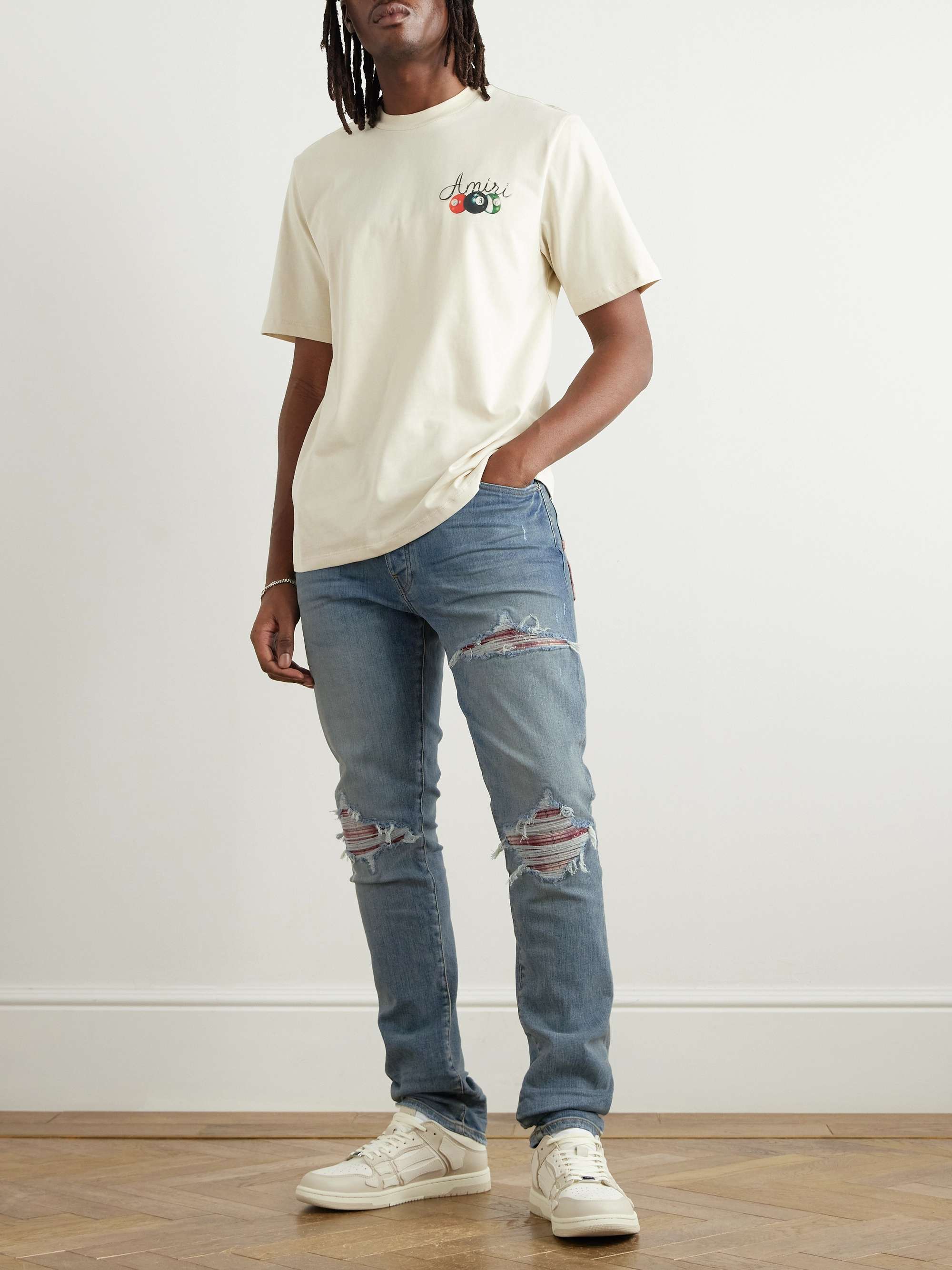 Skinny-Fit Distressed Patchwork Jeans view