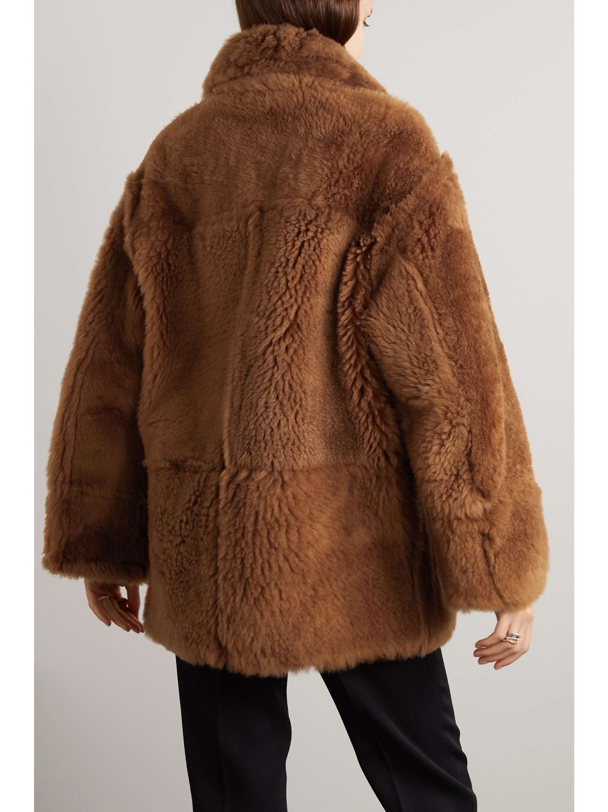Double-breasted reversible shearling and leather coat view