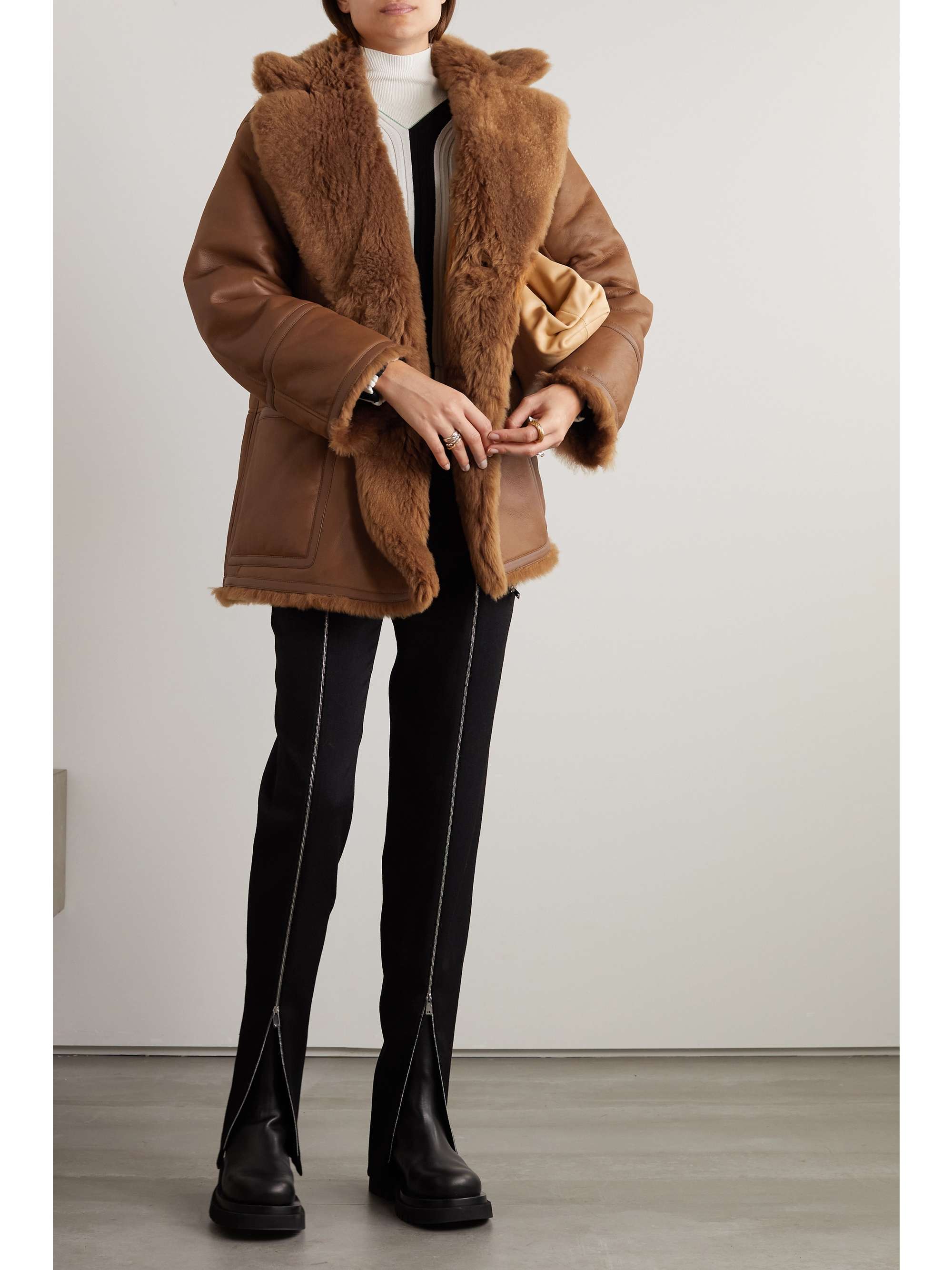 Double-breasted reversible shearling and leather coat view