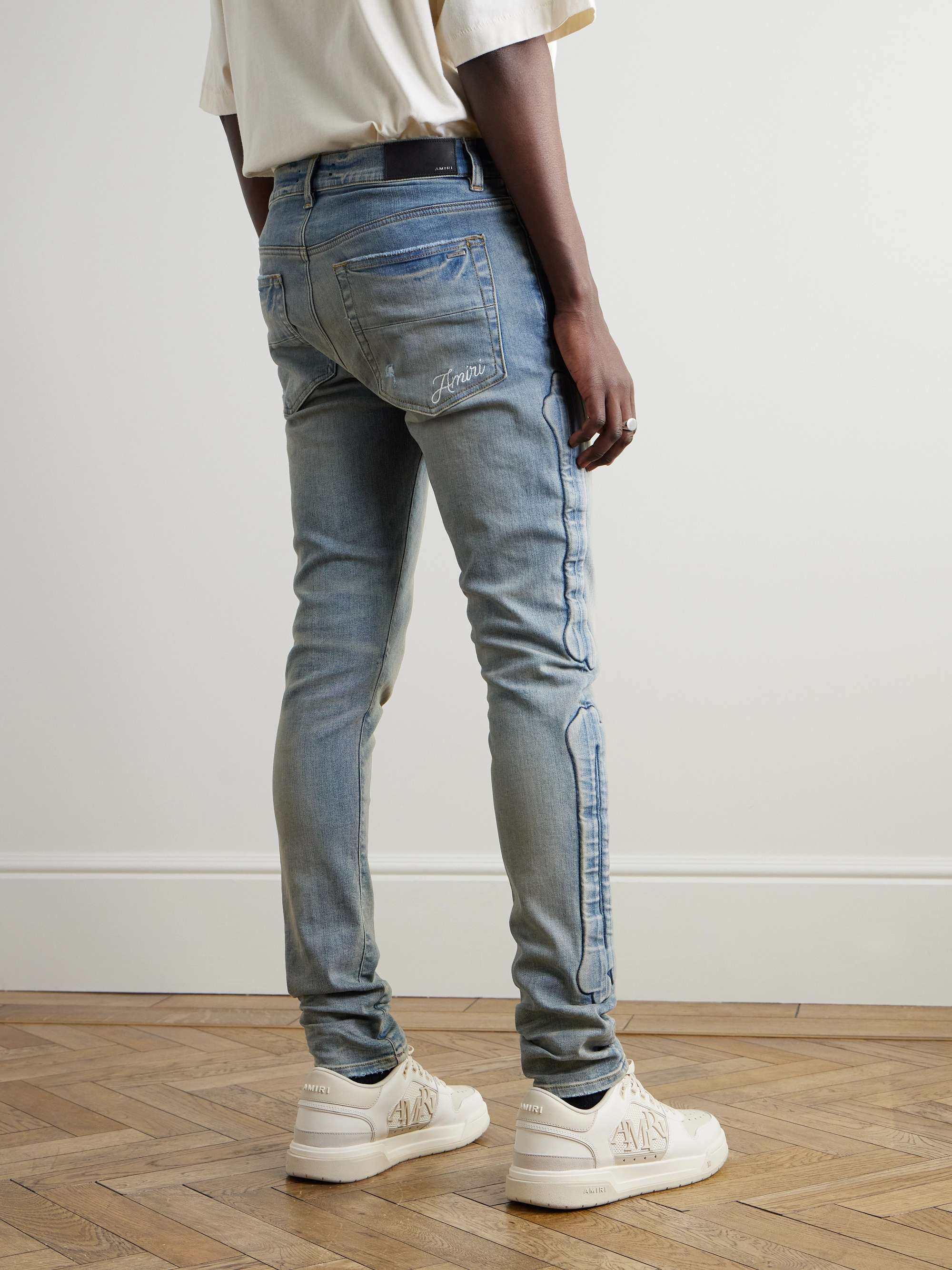 3D Bones Skinny-Fit Distressed Appliquéd Jeans view