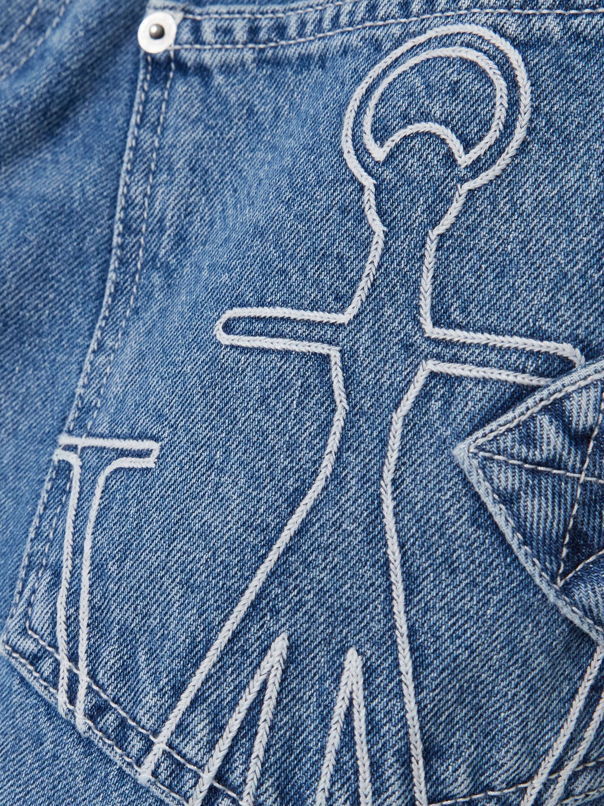 Twisted asymmetric embroidered high-rise jeans view