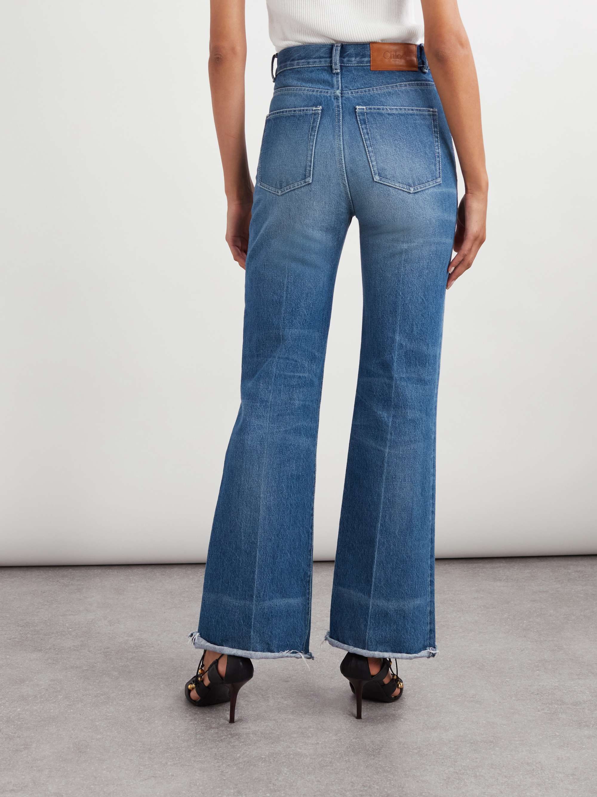 Frayed high-rise flared jeans view