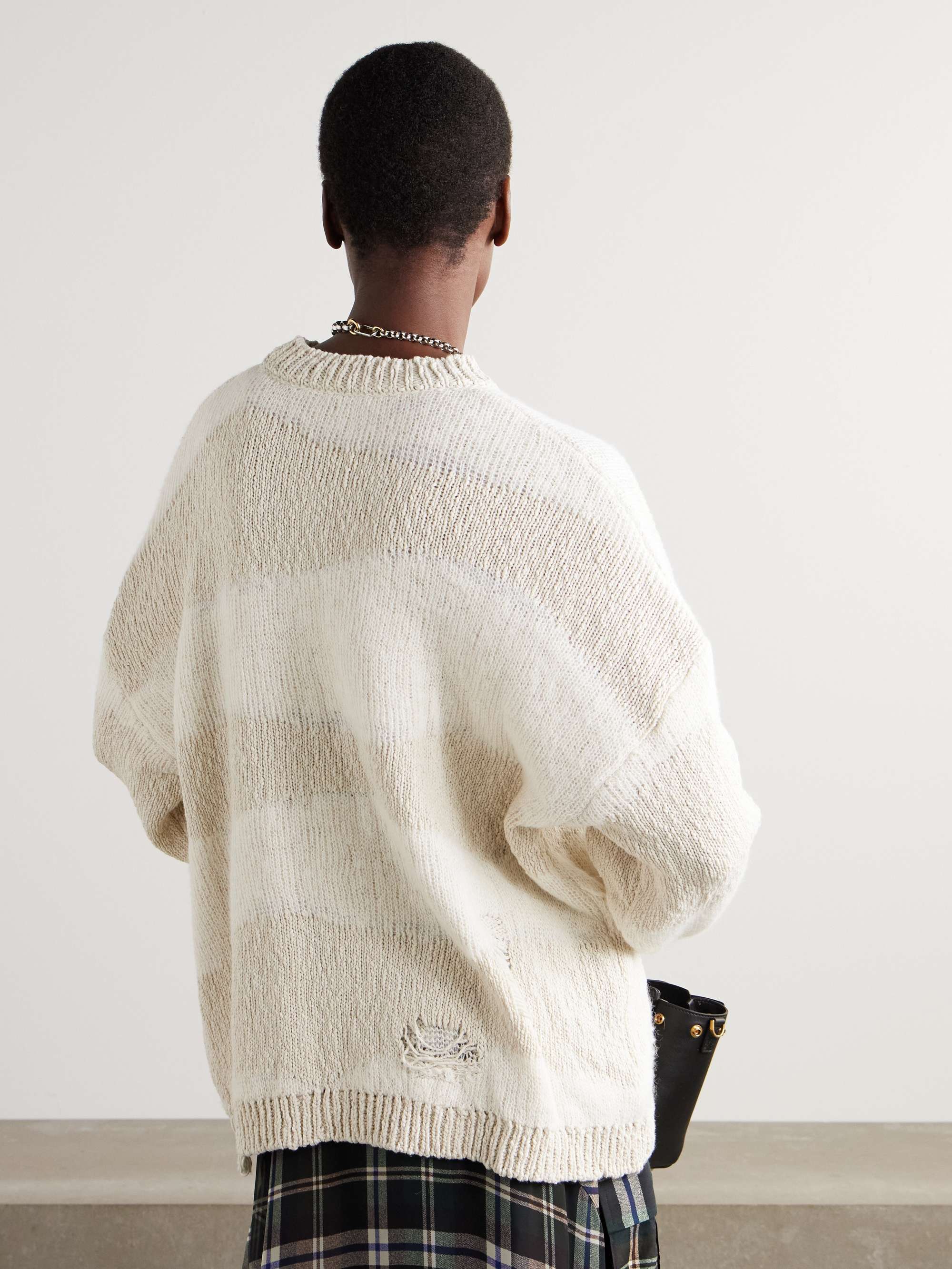 Popover distressed striped cotton and linen-blend sweater view