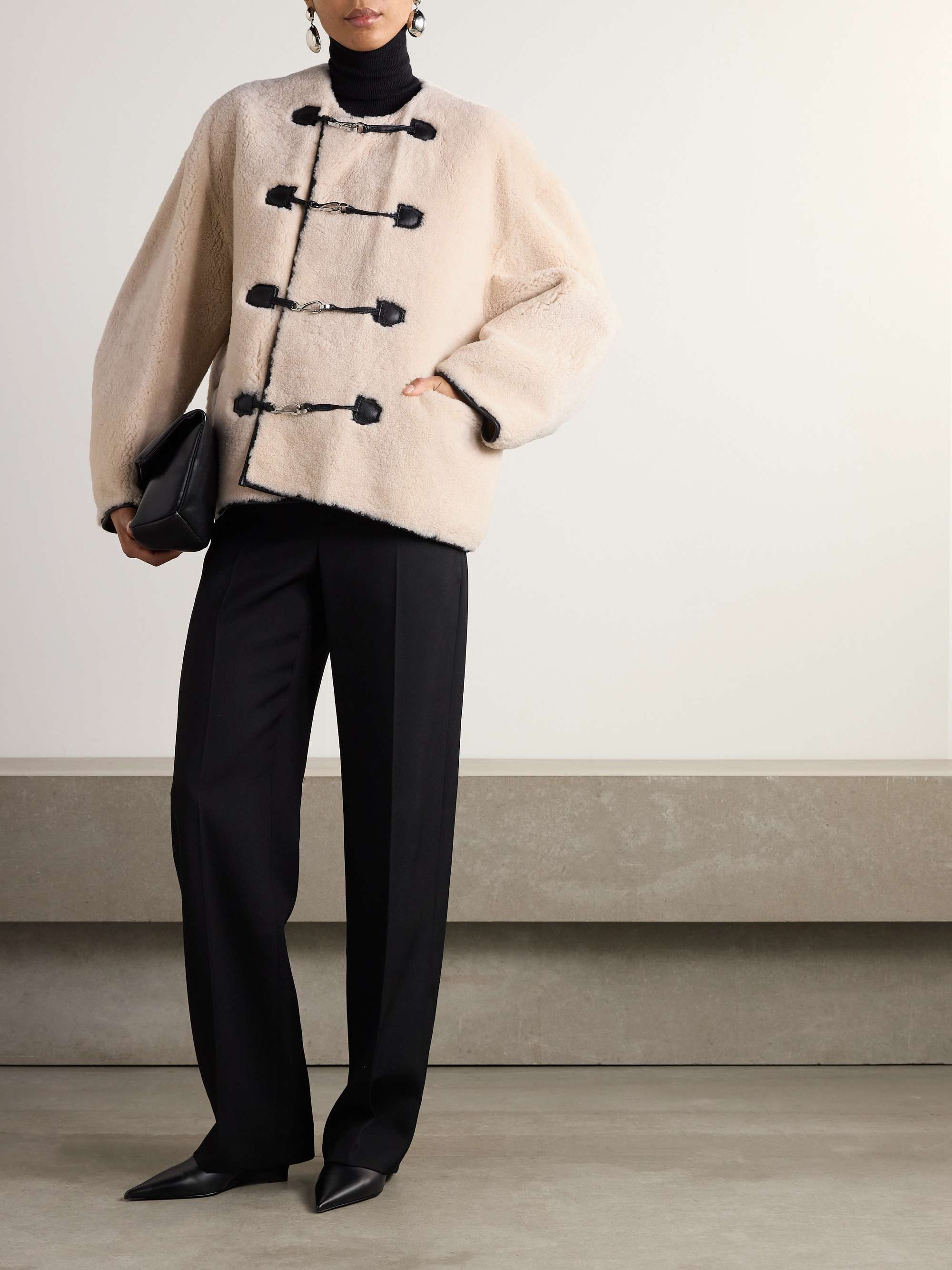 Leather-trimmed shearling jacket view
