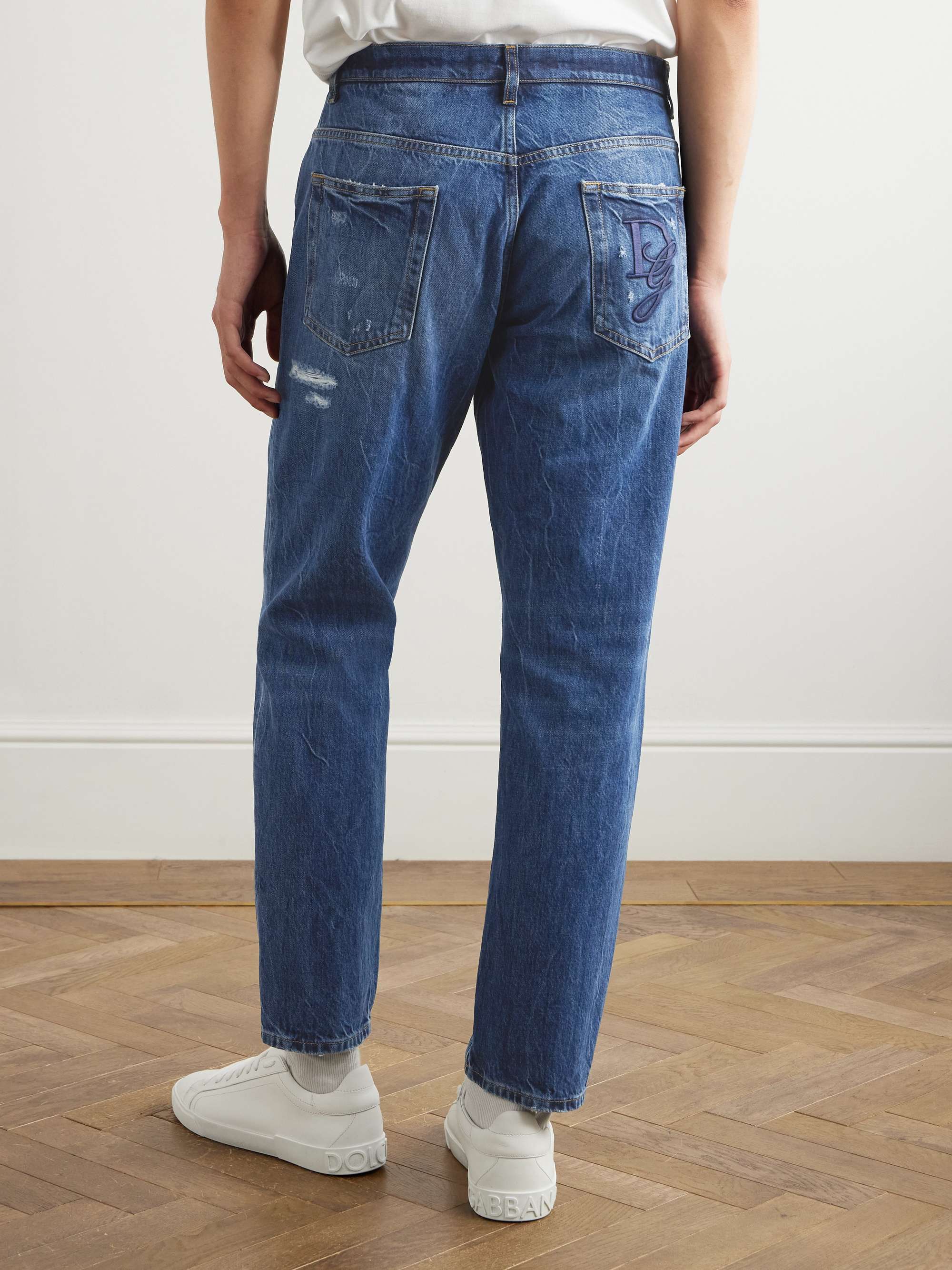 Slim-Fit Tapered Logo-Embroidered Distressed Jeans view