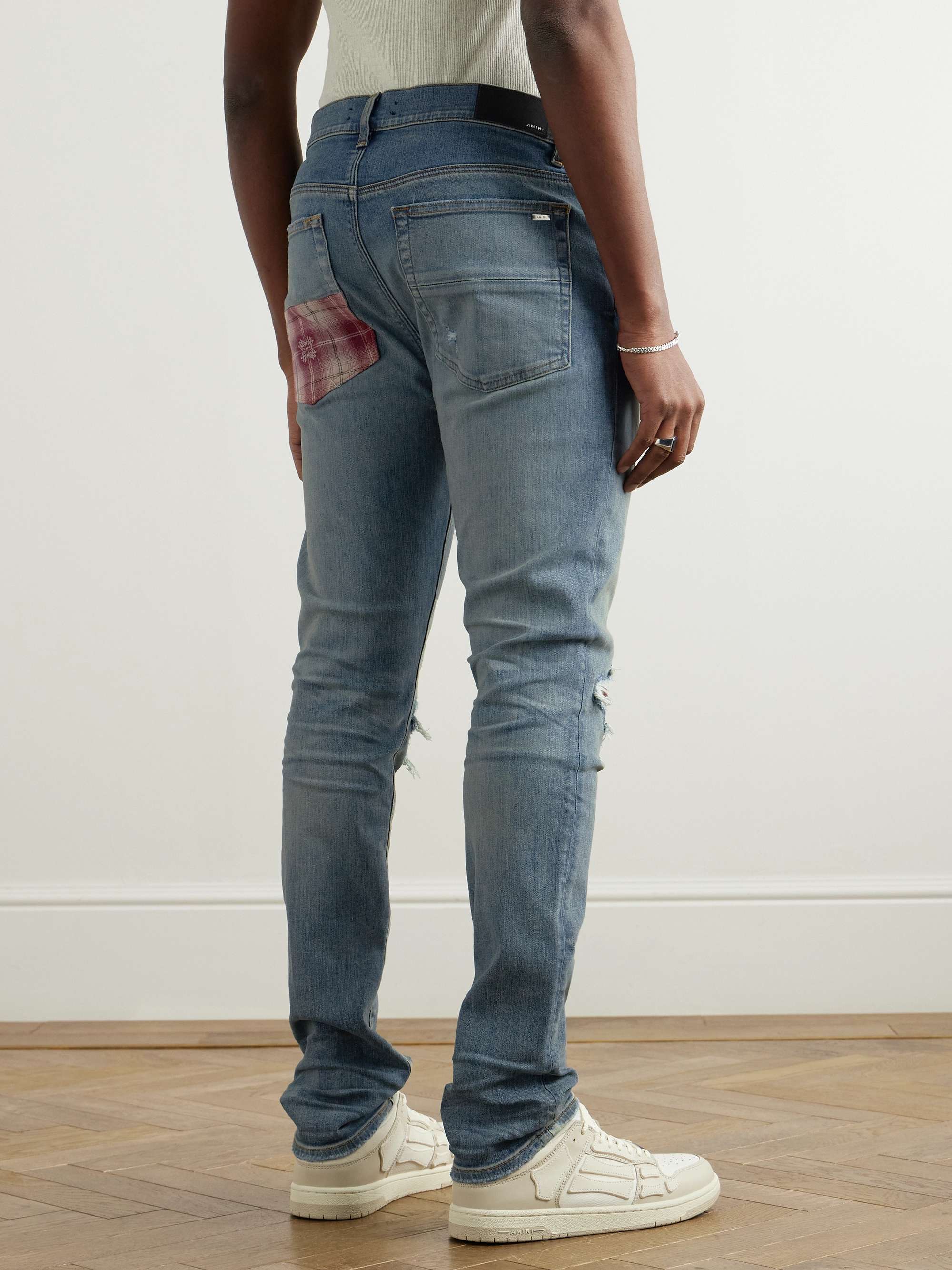 Skinny-Fit Distressed Patchwork Jeans view