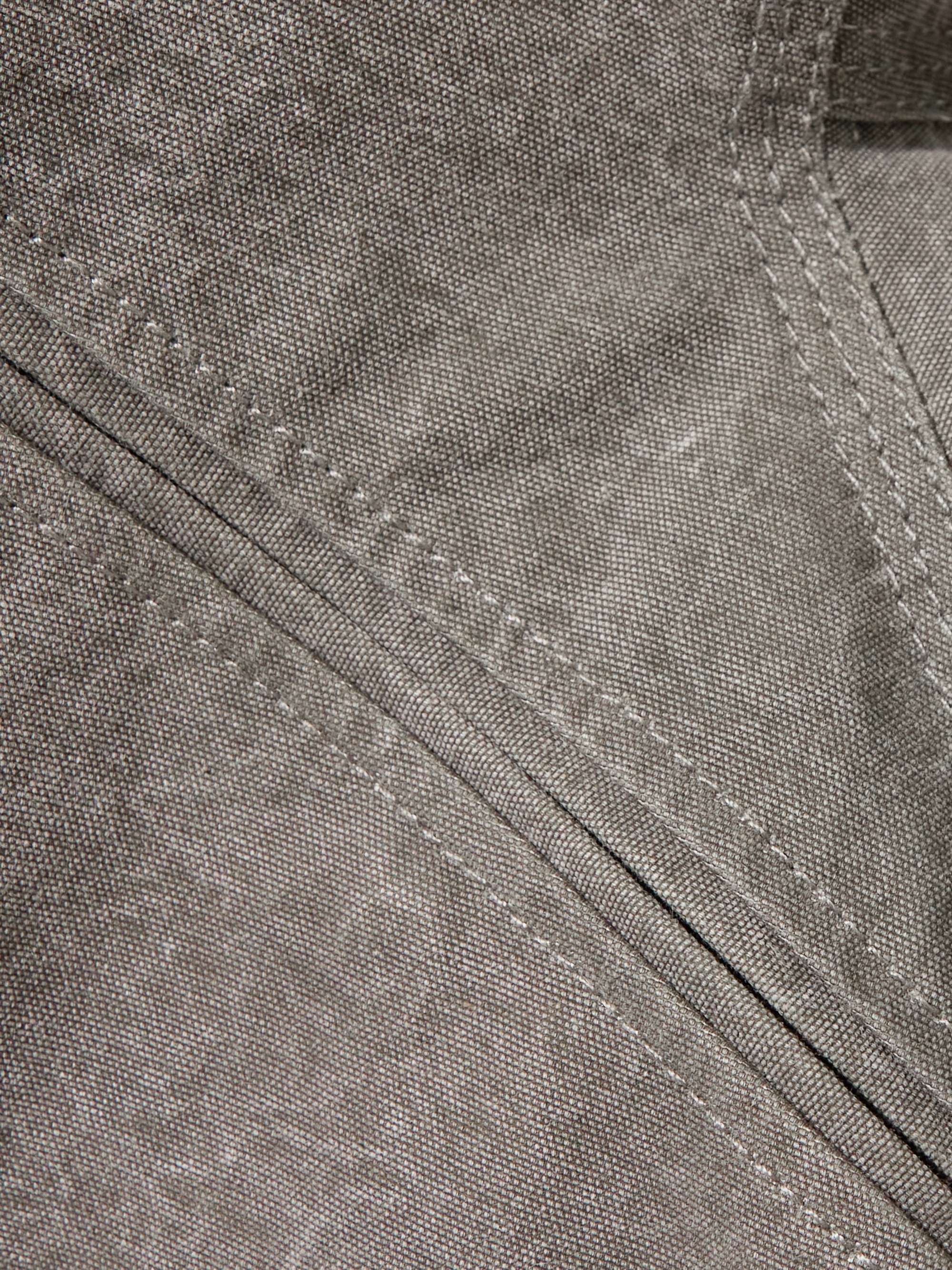 Paneled leather-trimmed cotton-canvas peplum jacket view