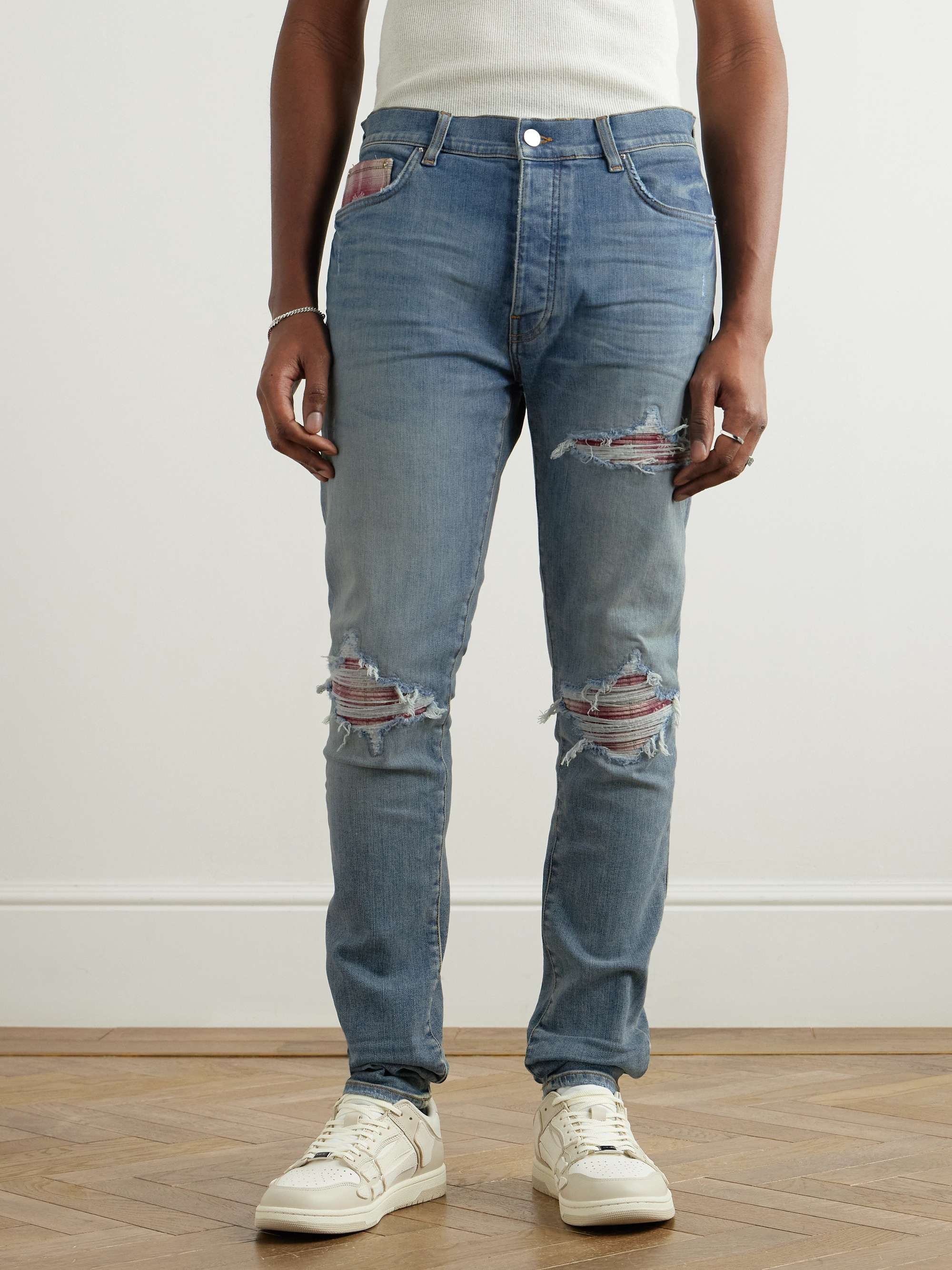 Skinny-Fit Distressed Patchwork Jeans view