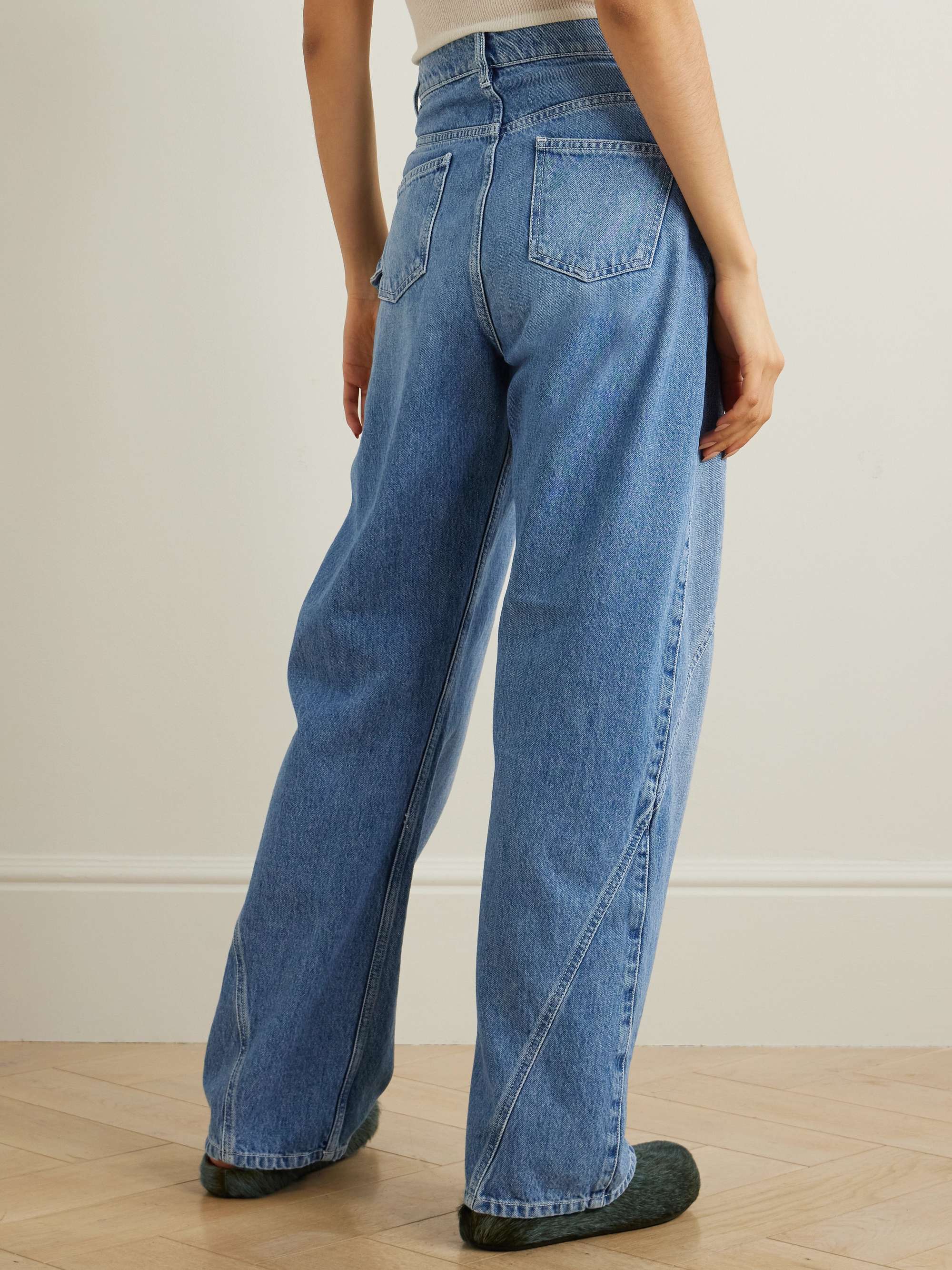 Twisted asymmetric embroidered high-rise jeans view