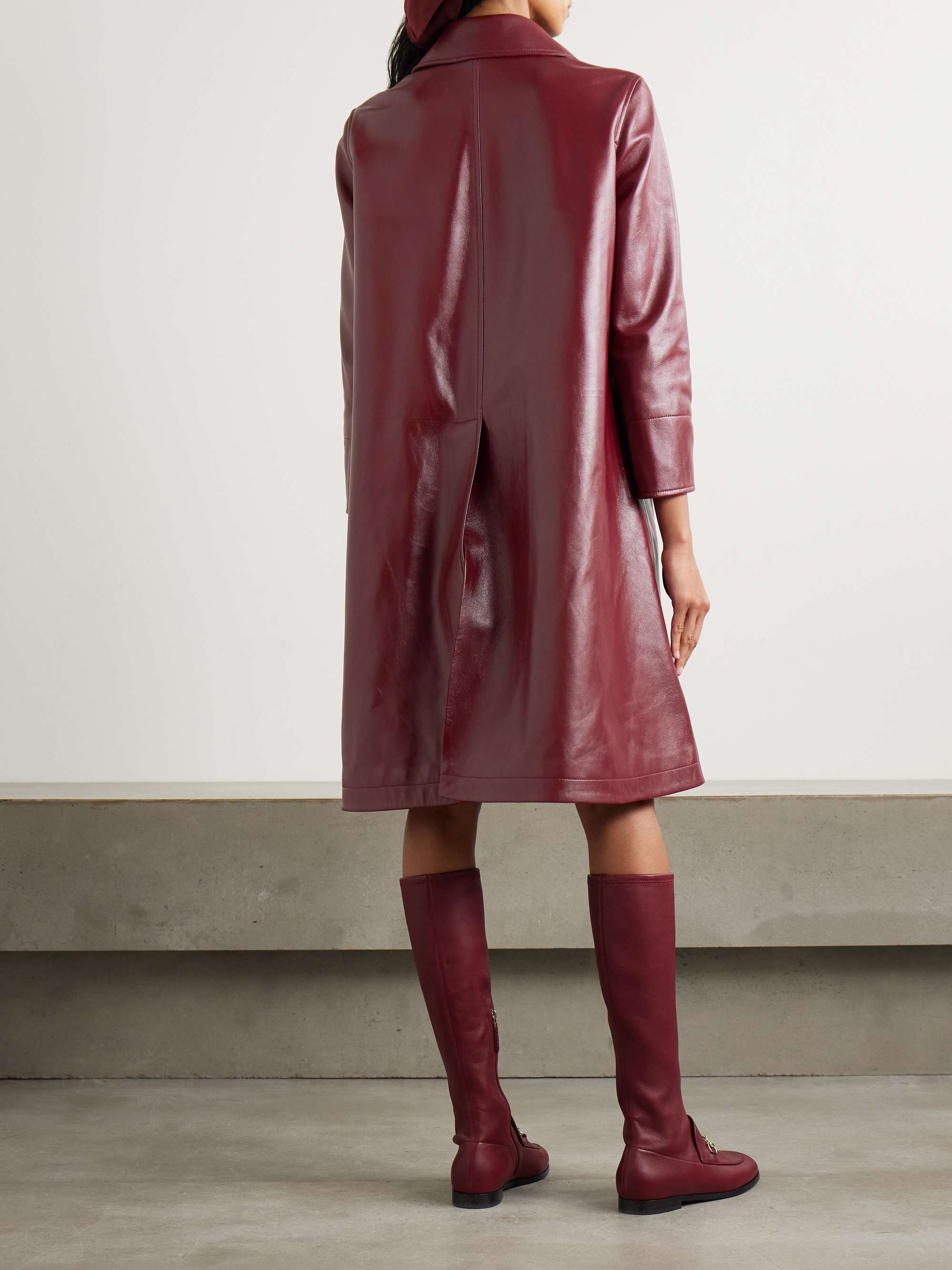 Double-breasted glossed-leather trench coat view