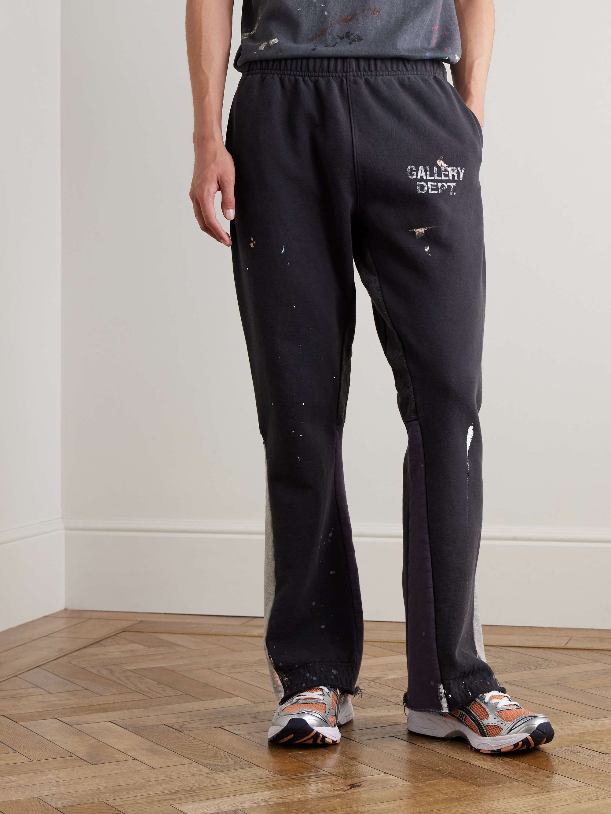Flared Paint-Splattered Panelled Logo-Print Cotton-Jersey Sweatpants view