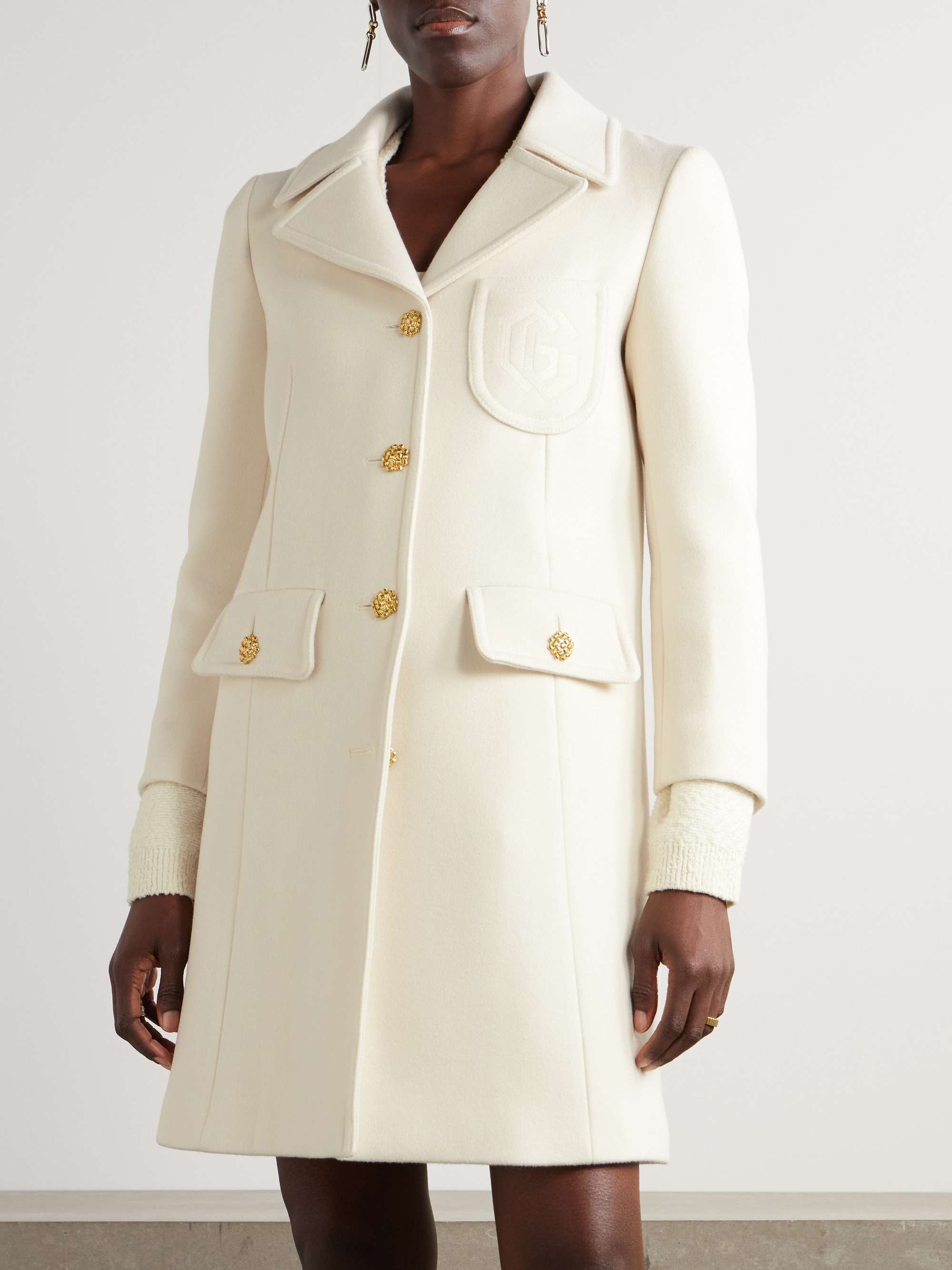 Button-embellished wool coat view