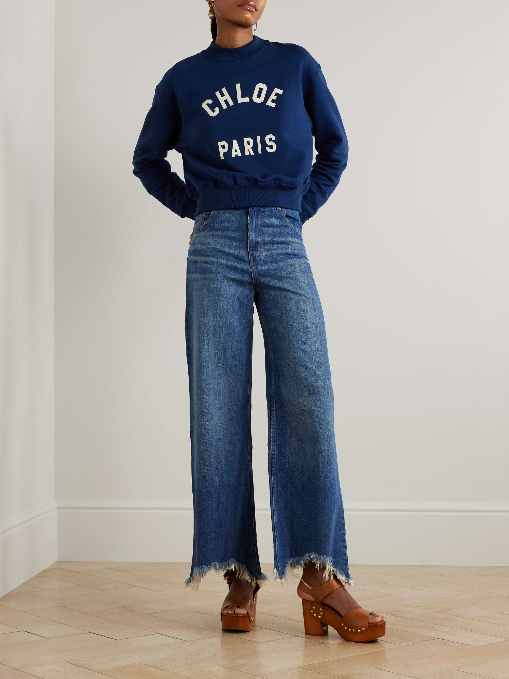 Cropped distressed high-rise wide-leg jeans view