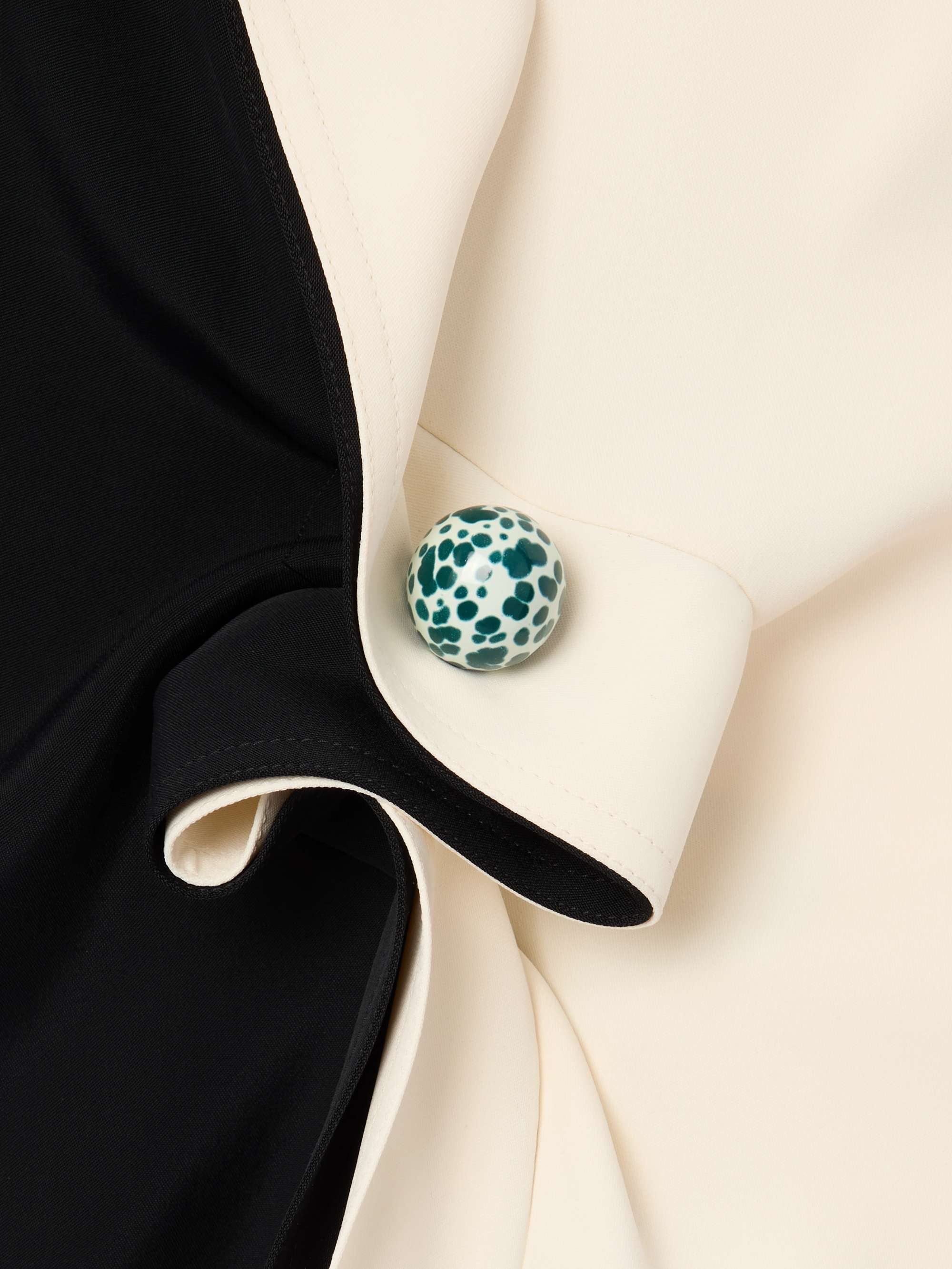 Embellished ruffled draped two-tone crepe top view