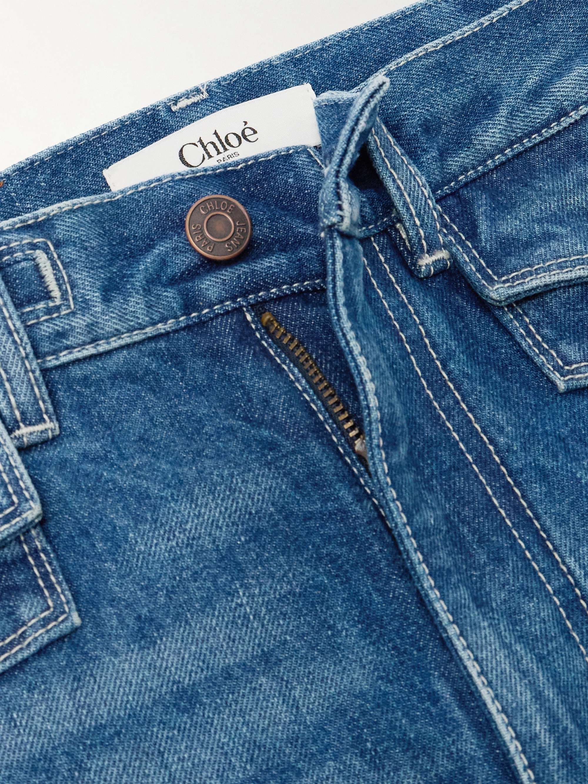 Frayed high-rise flared jeans view