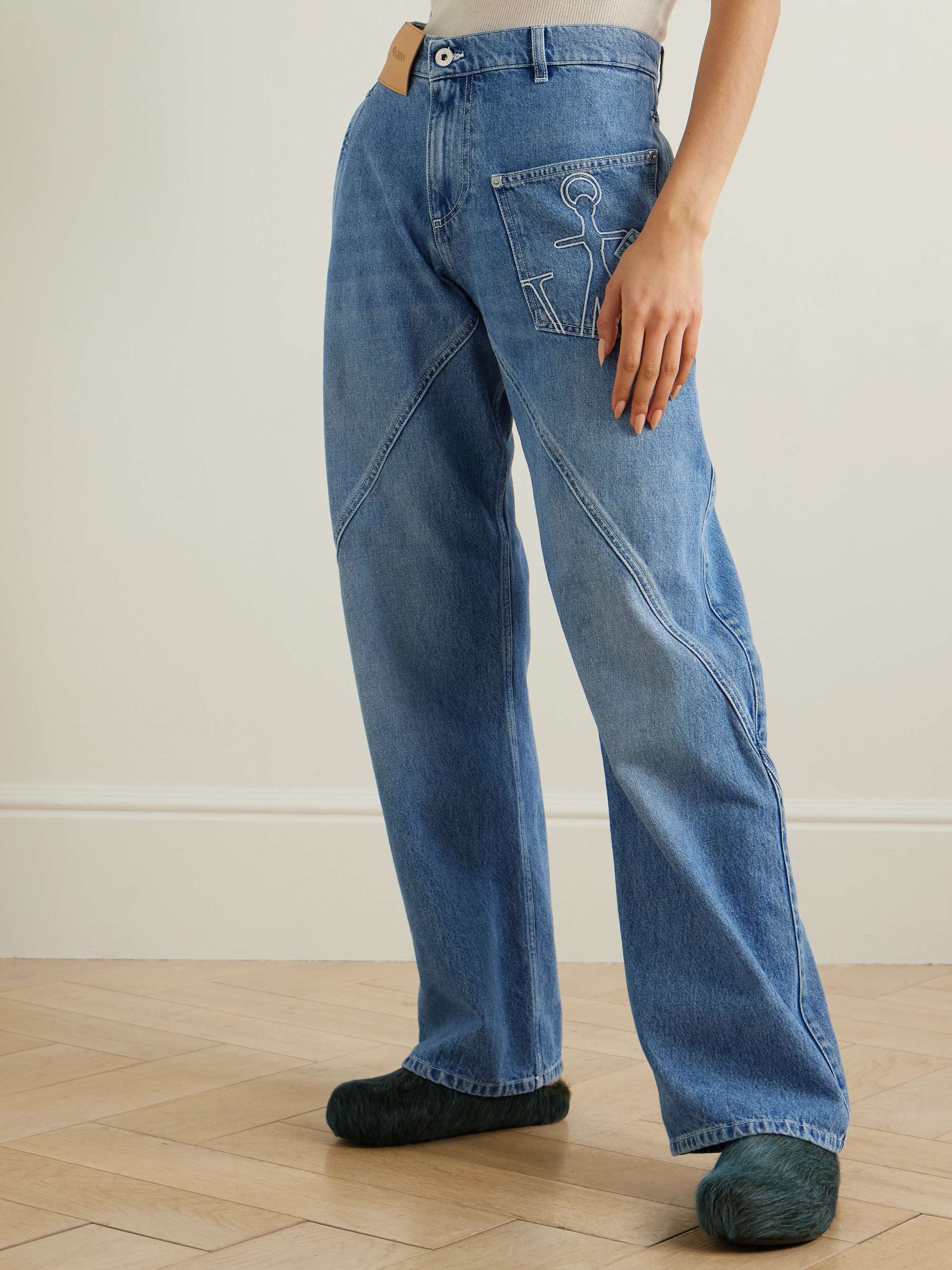 Twisted asymmetric embroidered high-rise jeans view