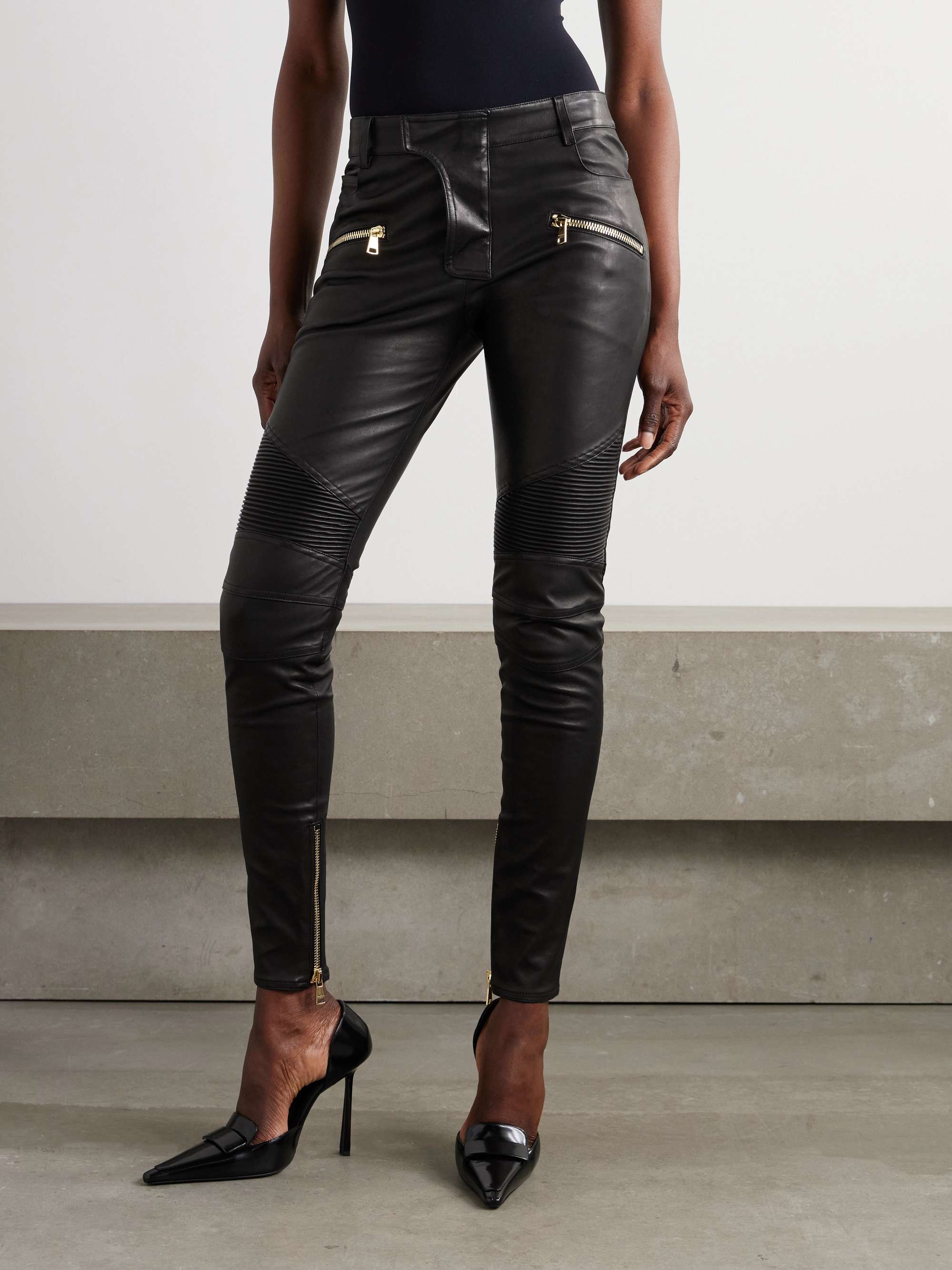 Zip-detailed paneled leather skinny pants view