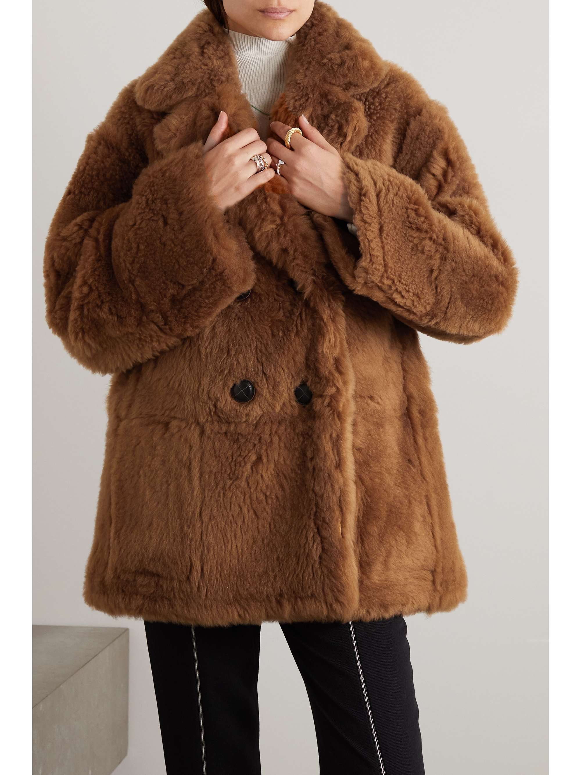 Double-breasted reversible shearling and leather coat view