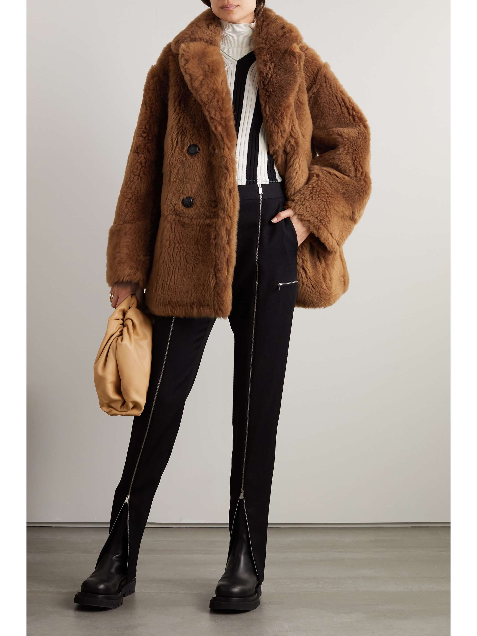 Double-breasted reversible shearling and leather coat view