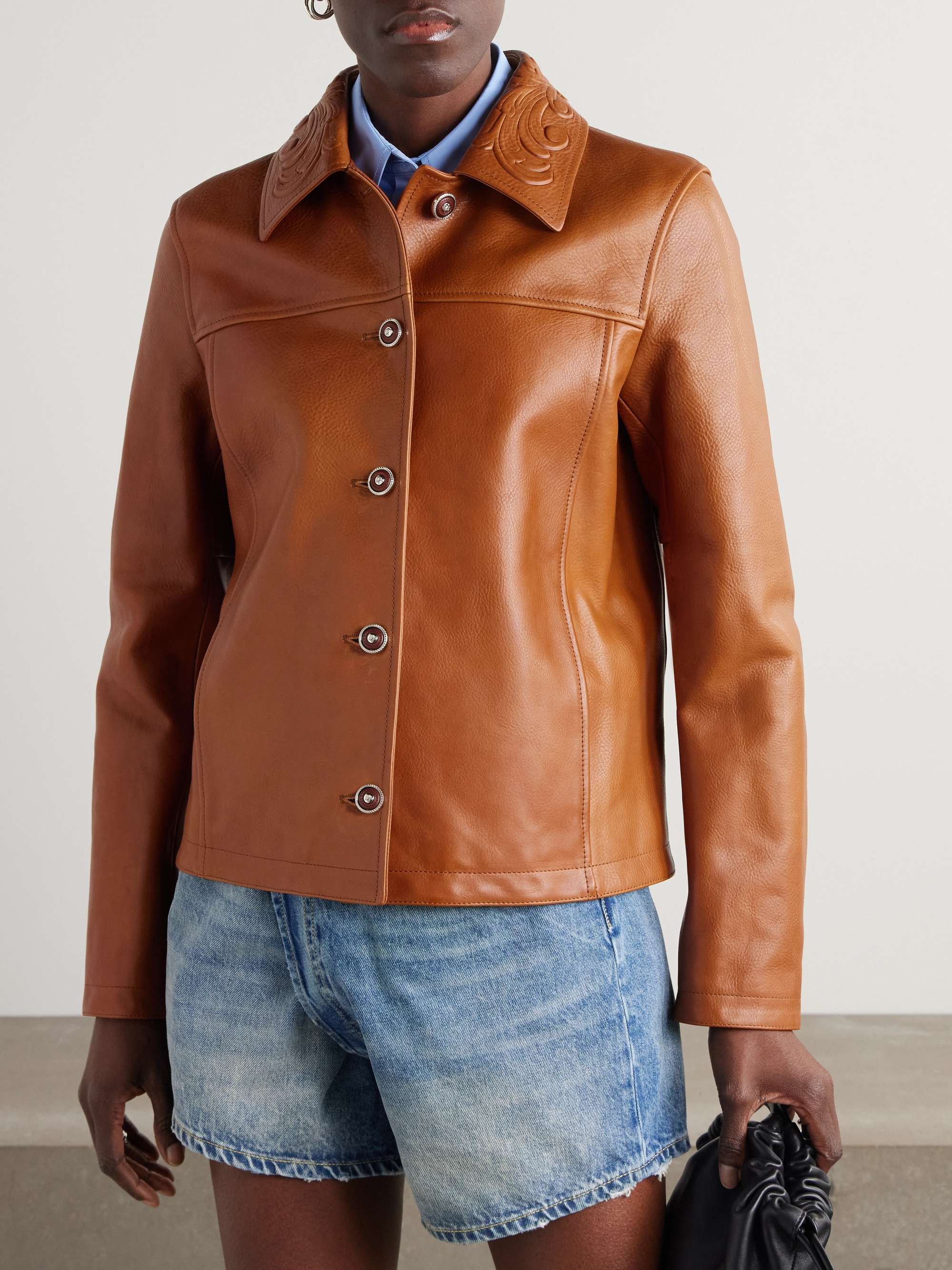 Debossed paneled textured-leather jacket view