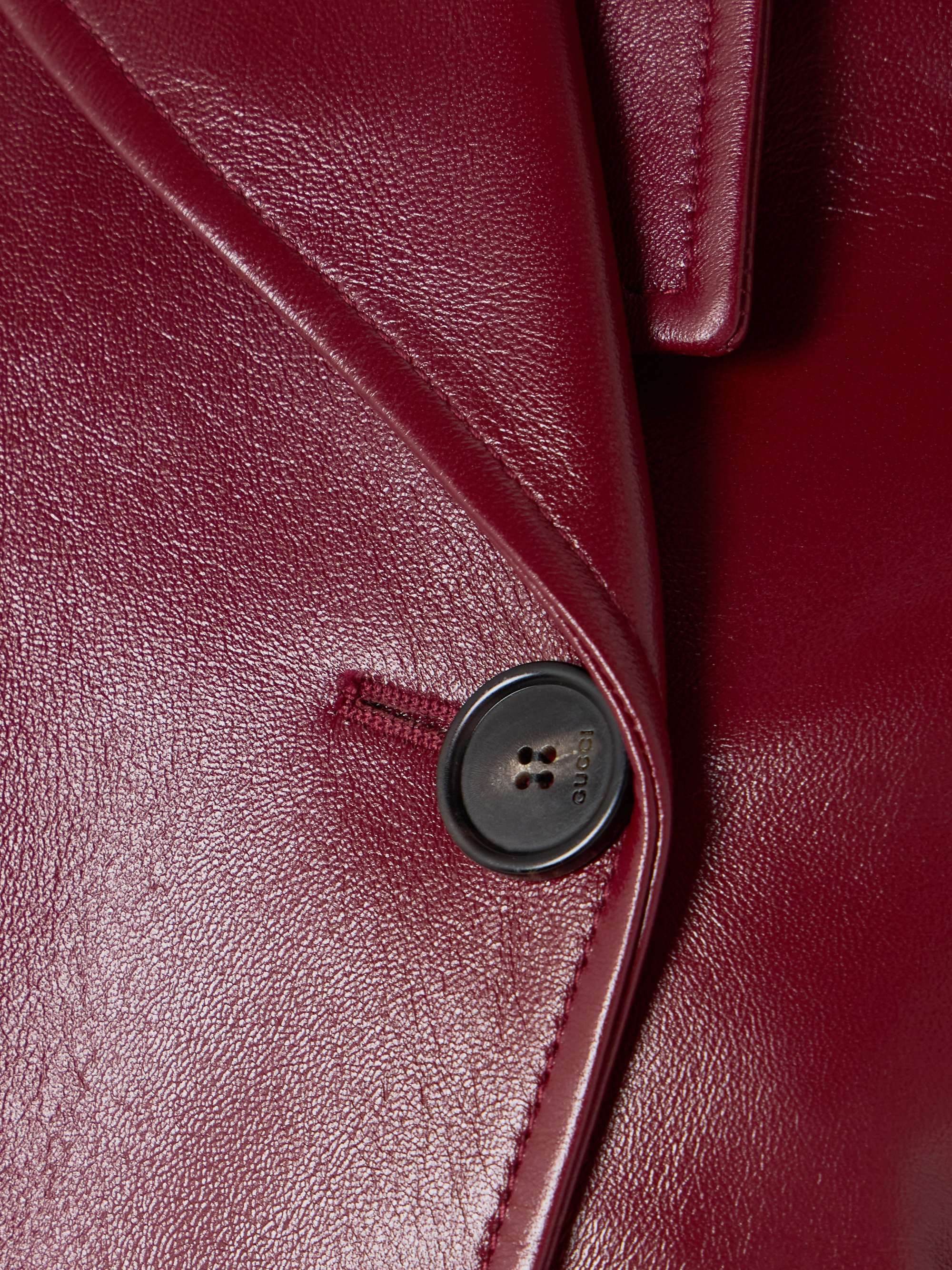 Double-breasted glossed-leather trench coat view